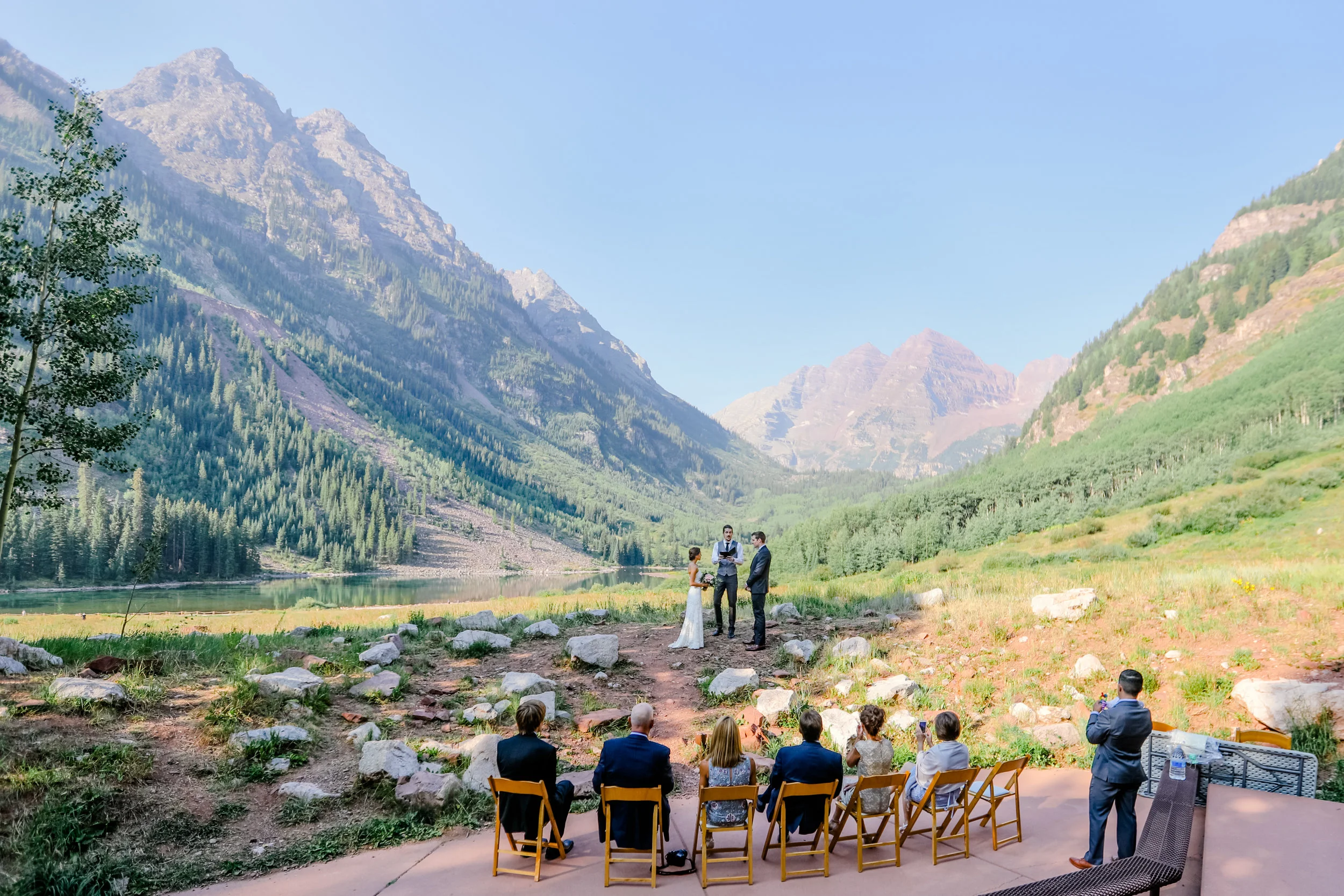 elopement wedding at maroon bells in aspen family watching while vows are read