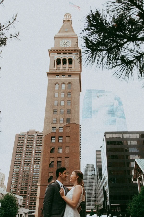 couple dancing outside the denver clock tower after their small wedding elopement