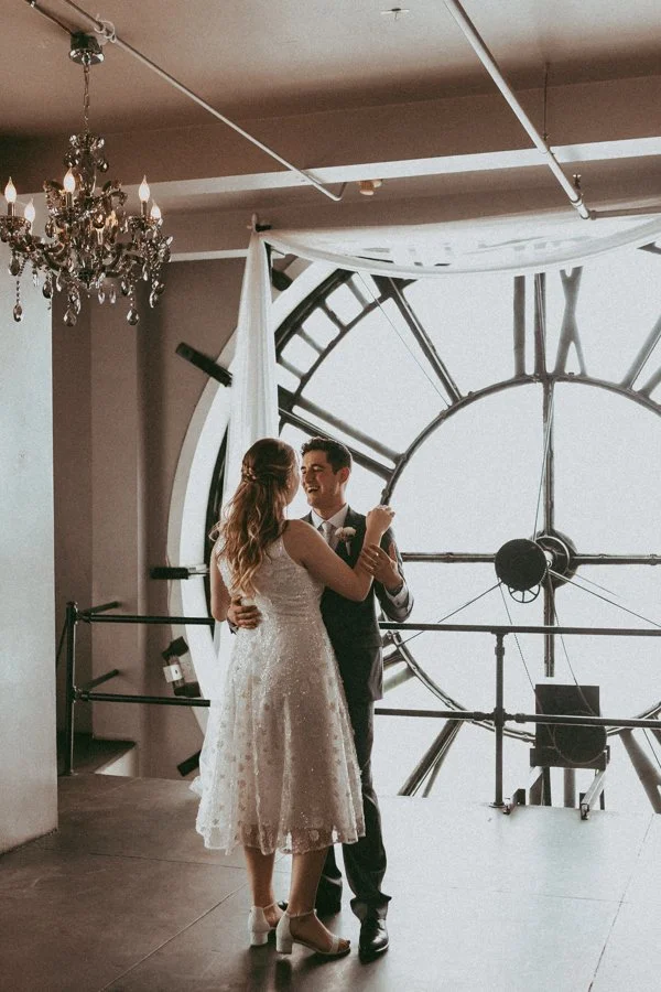 small wedding couple enjoying their reception at the denver clock tower in colorado