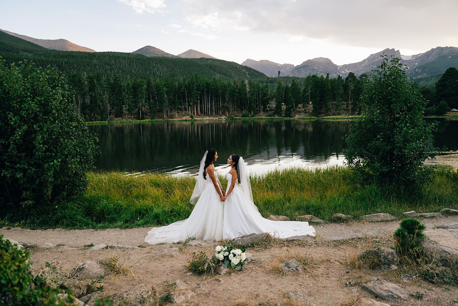 small wedding elopement with two brides at sprague lake in rocky mountain national park.