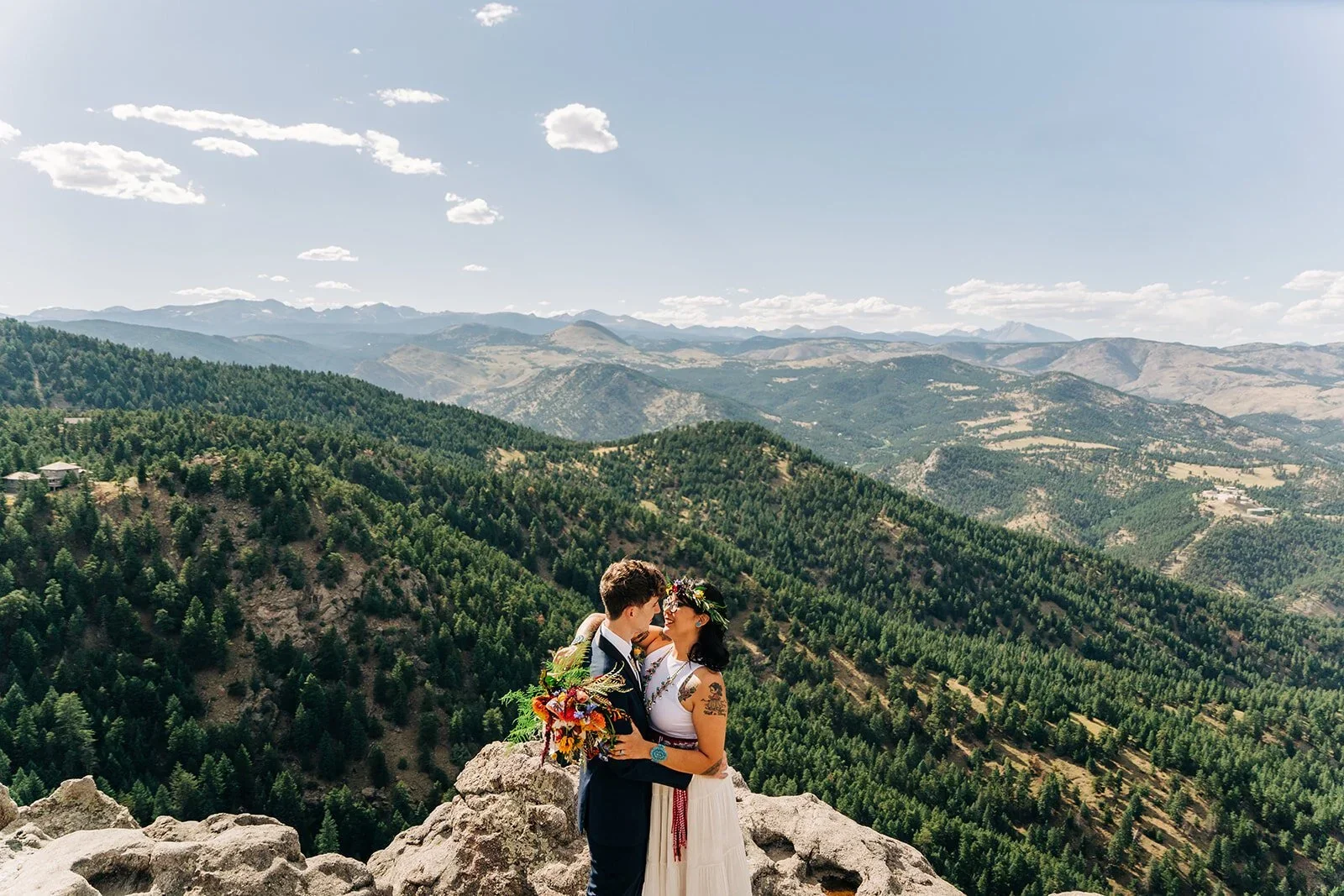 bride and groom kissing after a wedding ceremony at lost gulch overlook in boulder colorado