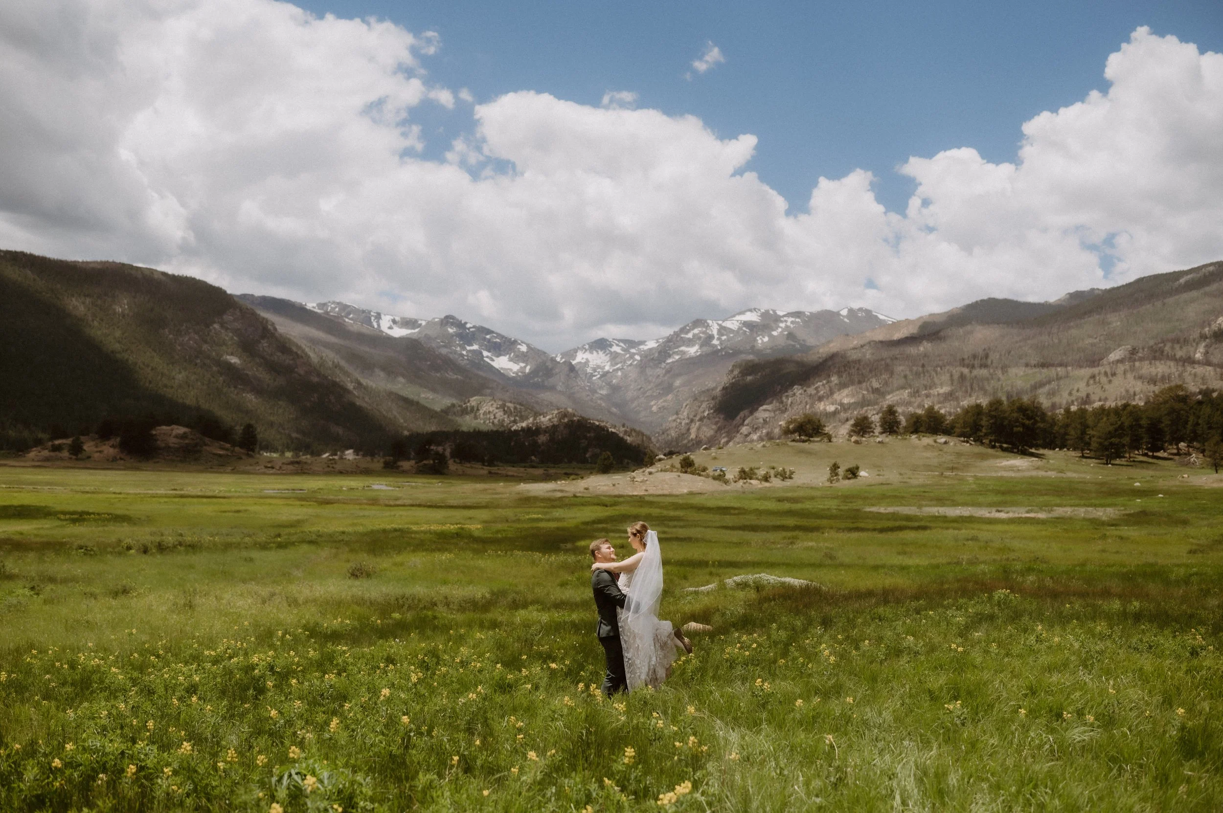 rocky mountain national park moraine park meadows mountain wedding elopement with wild flowers on a sunny day