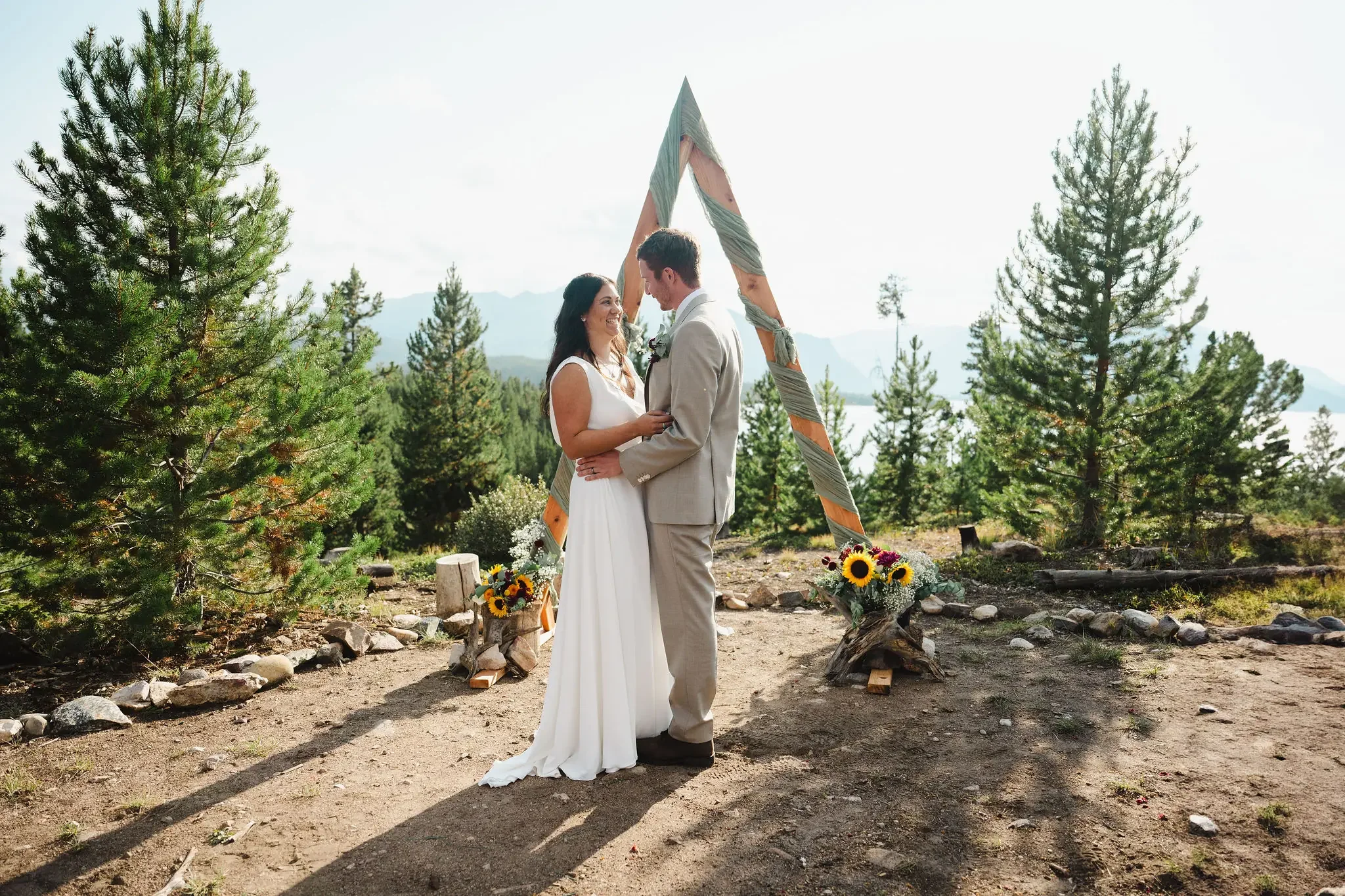 bride and groom having a wedding ceremony at Windy Point Campground ceremony site in Colorado, near Dillon