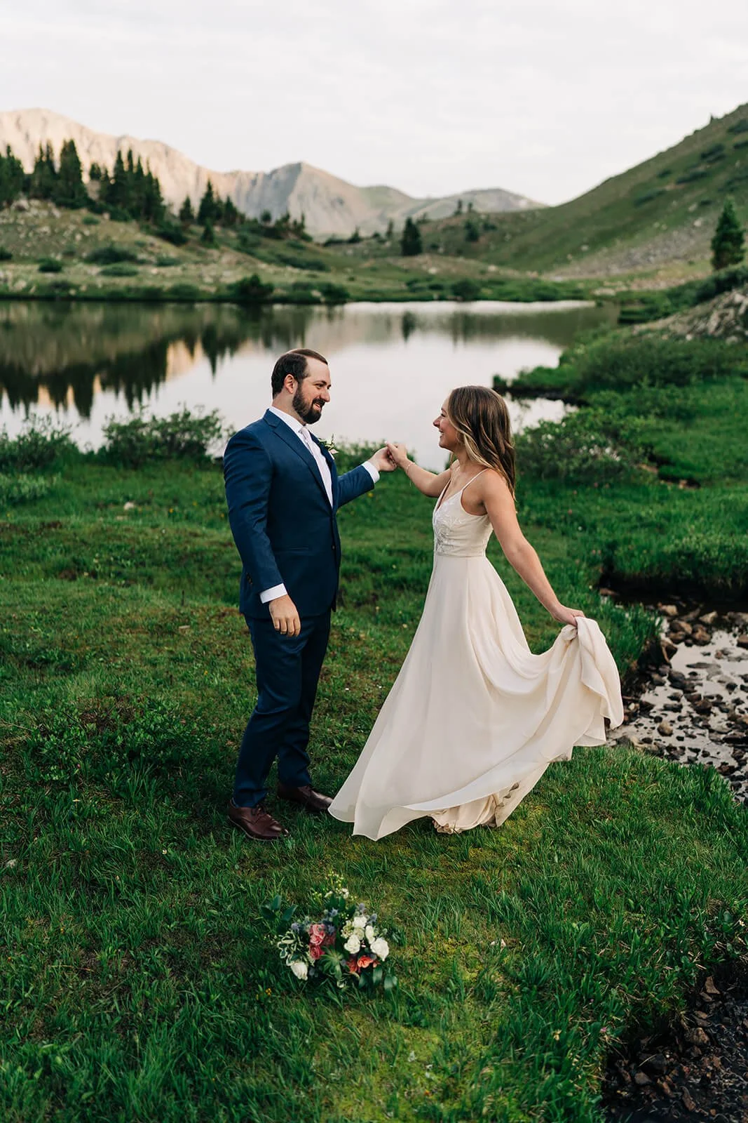 bride and groom dancing at their wedding after eloping at pass lake near loveland pass colorado
