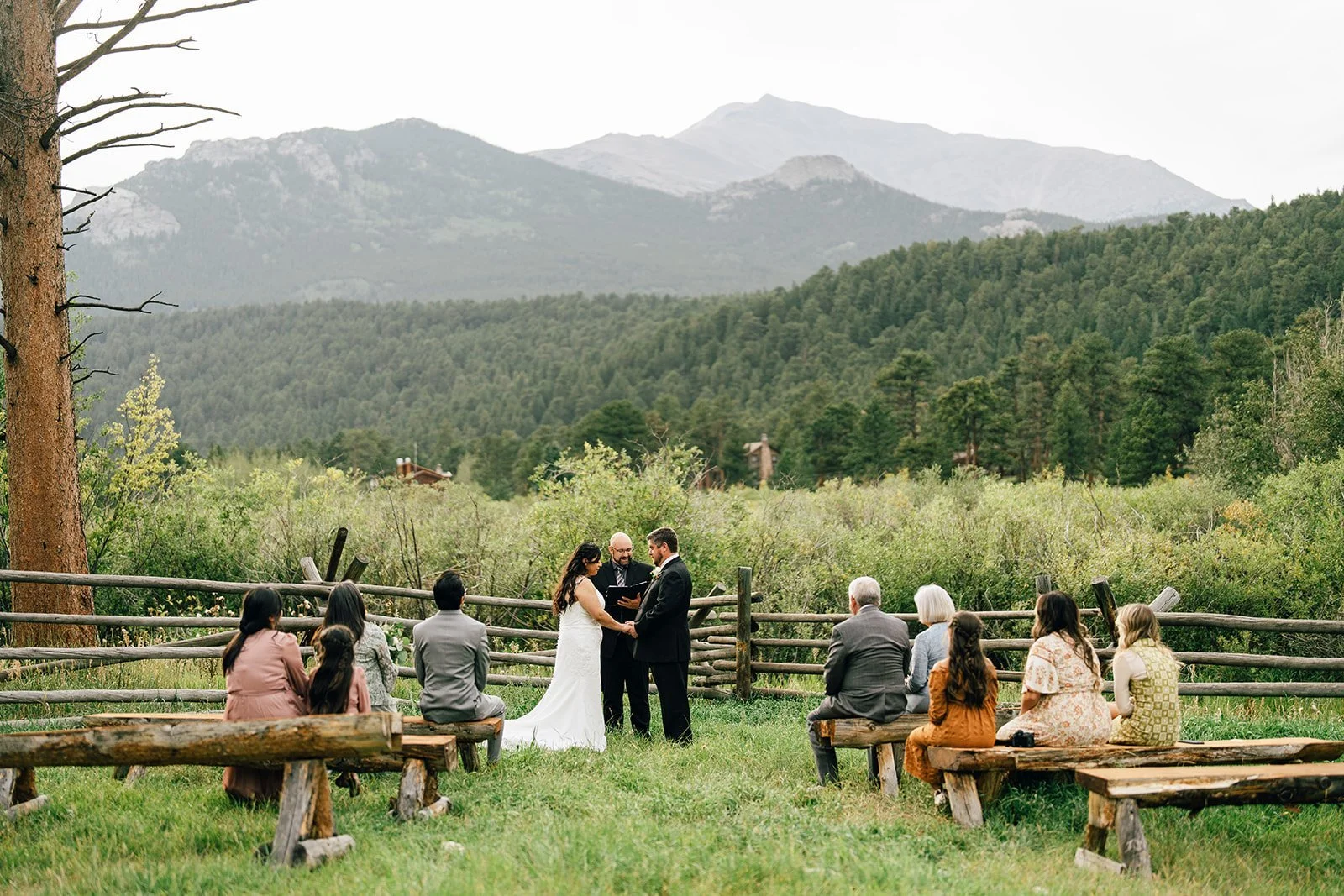 rocky mountain wedding and elopement park in estes park outside rocky mountain national park with small wedding happening during ceremony