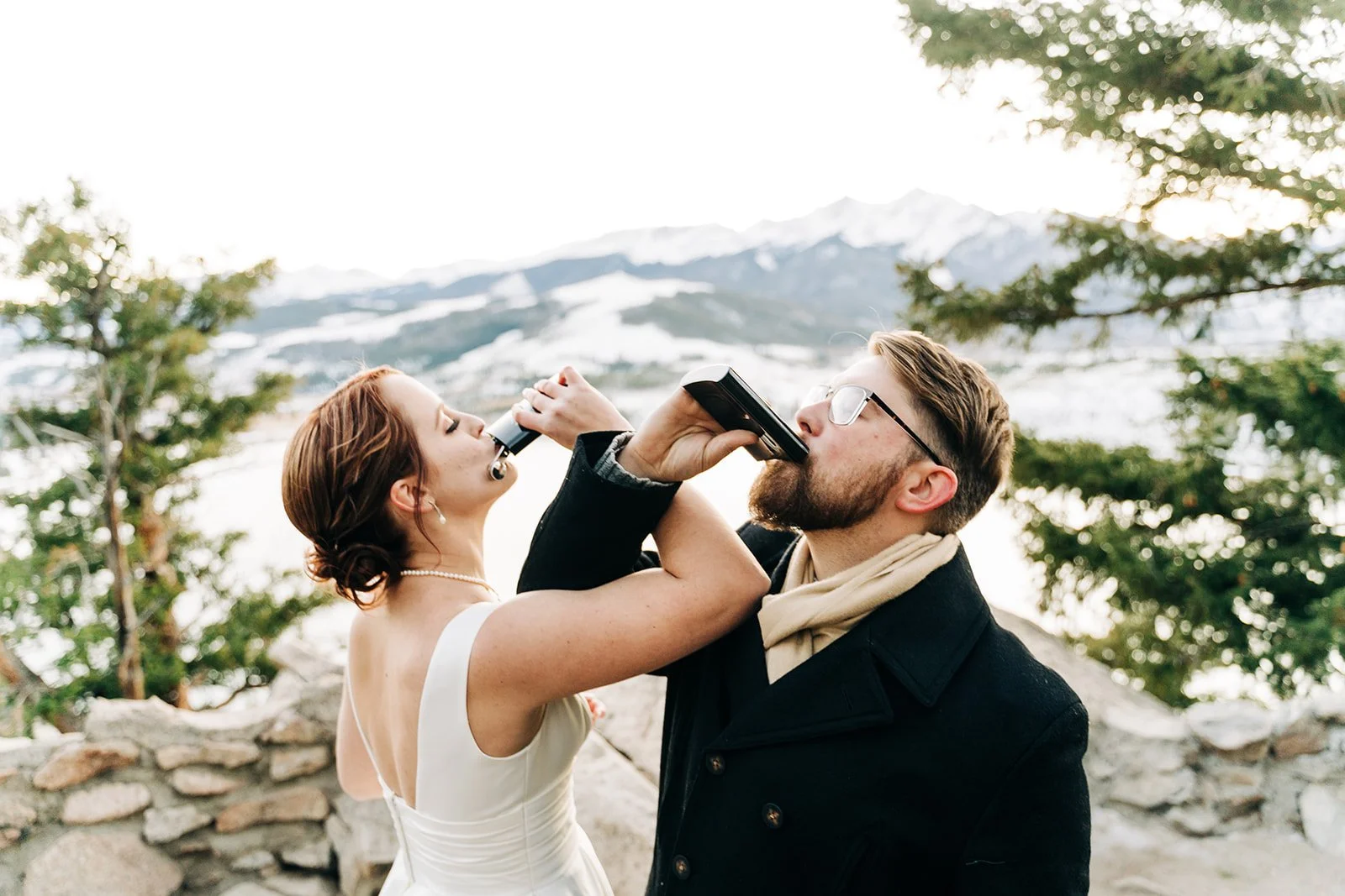 rocky mountain national park bride and groom having a drink to celebrate their wedding