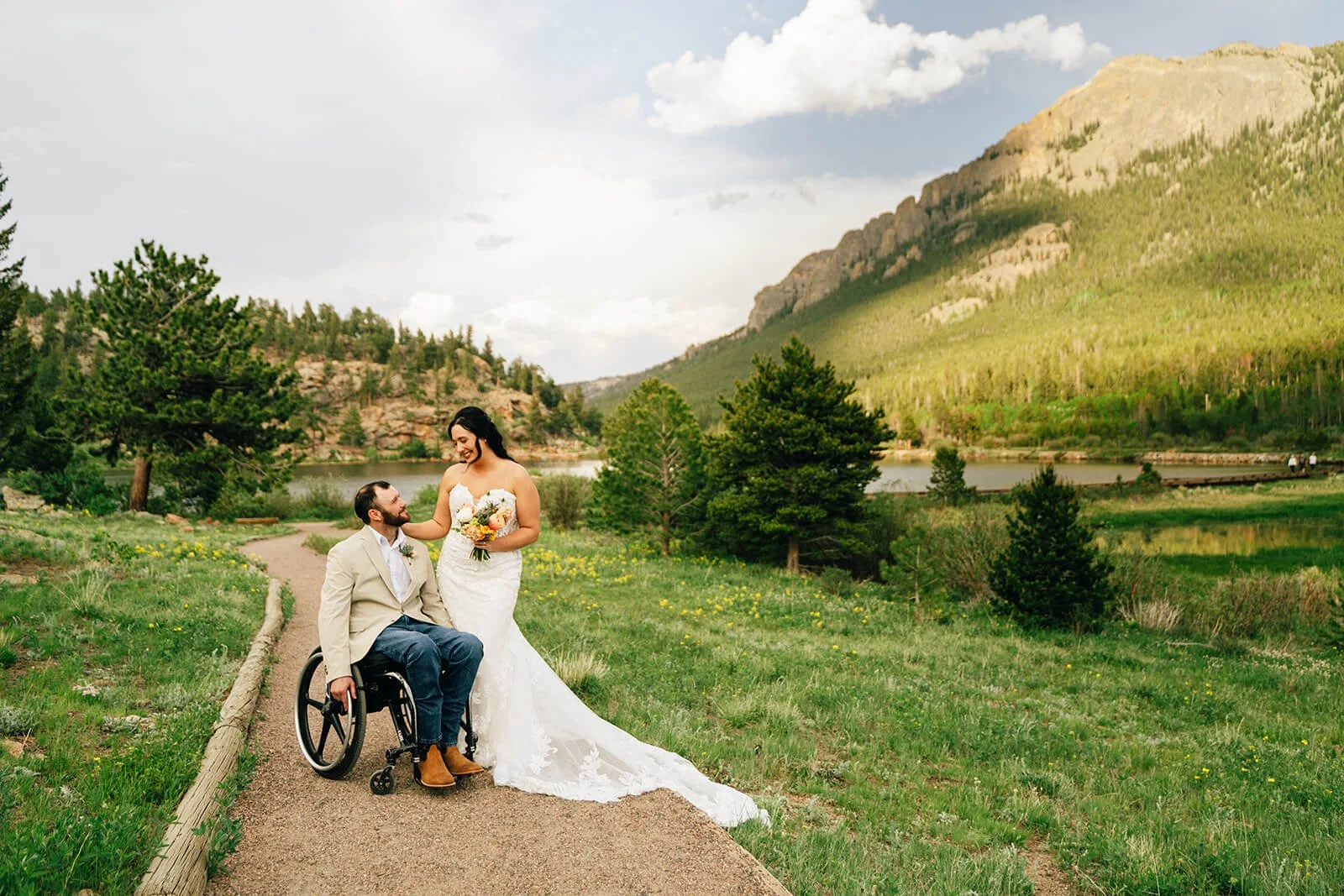 bride and groom taking portraits at their lily lake wedding in rocky mountain national park