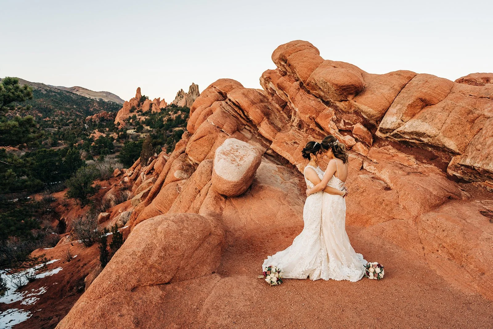 couple at garden of the gods exchange vows with snow on the ground for their wedding