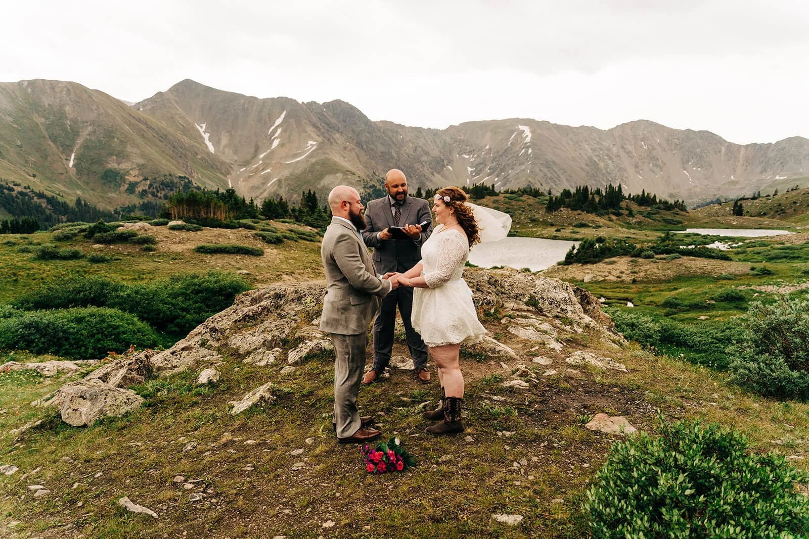 small wedding at loveland pass in colorado pass lake during sunset