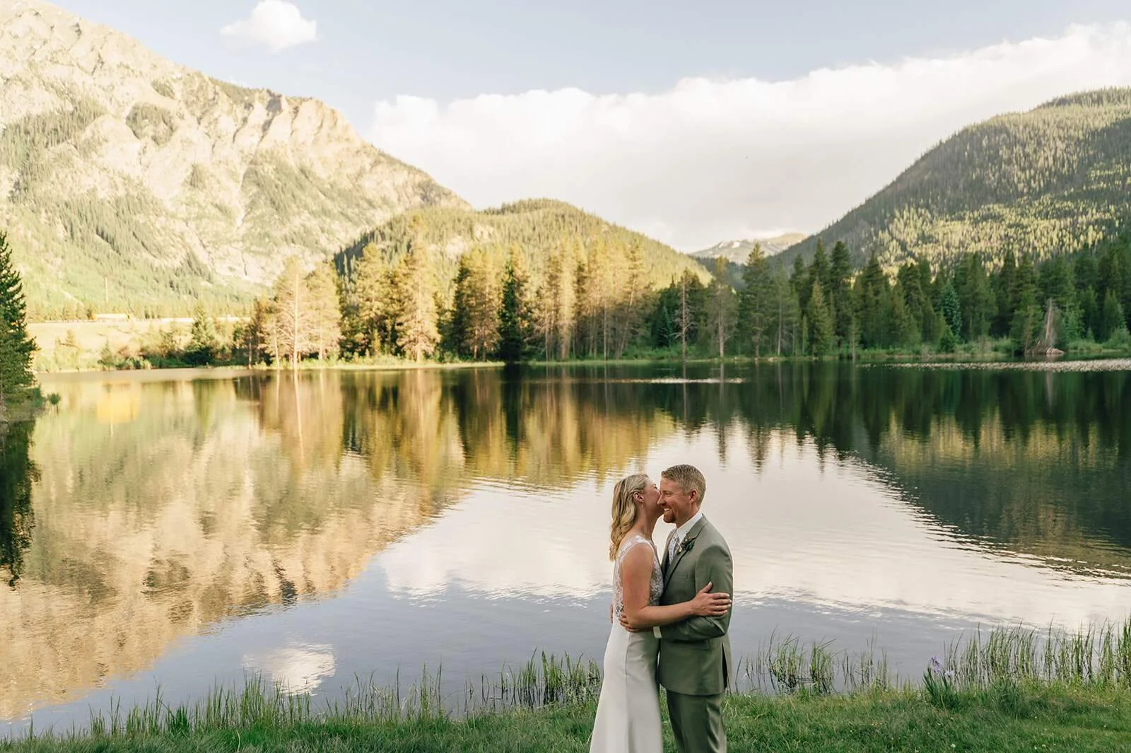 bride and groom doing their portrait session at sunset at officer's gulch near frisco colorado after their elopement ceremony.