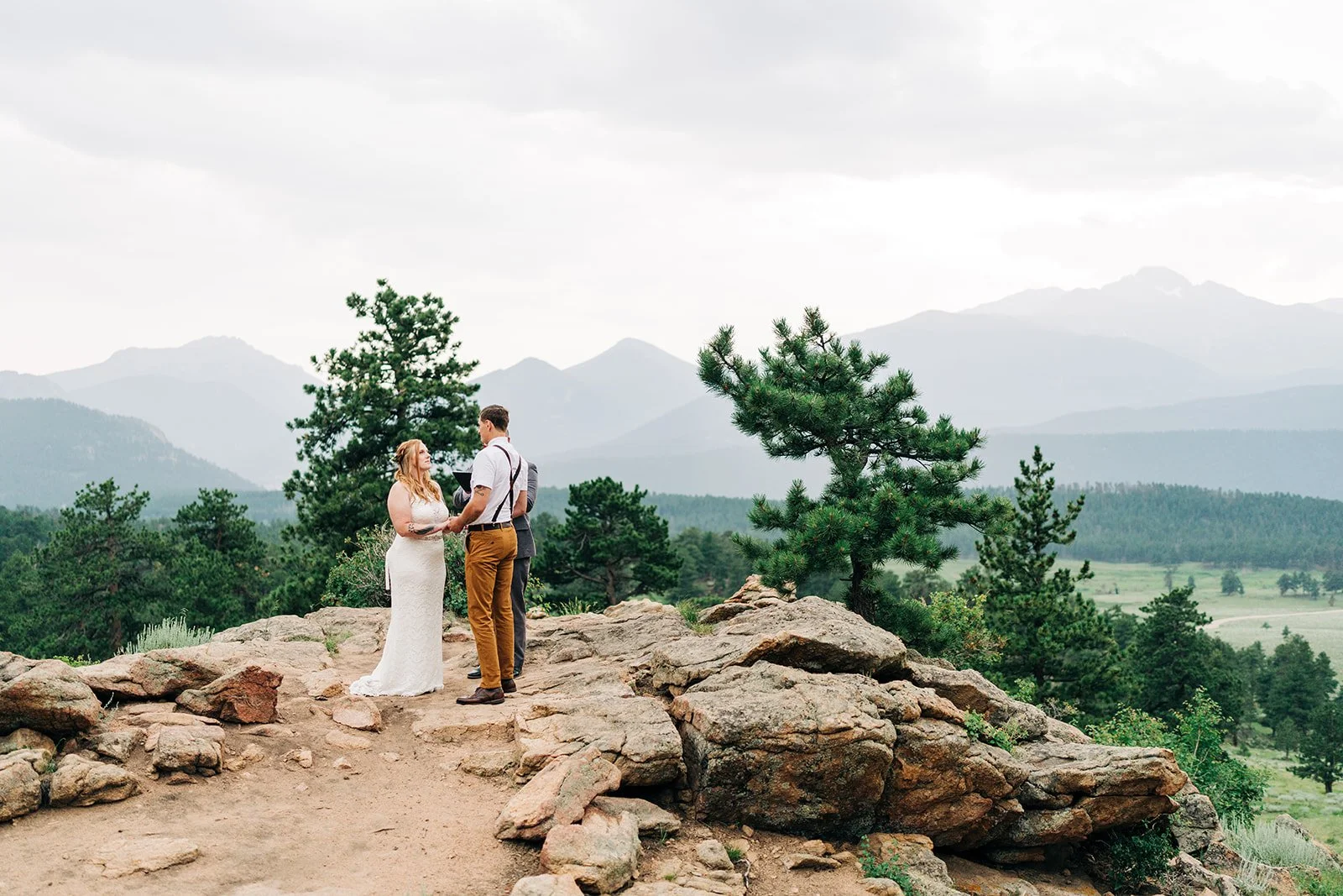 rocky mountain national park 3m curve ceremony stie at sunset with a wedding ceremony in progress
