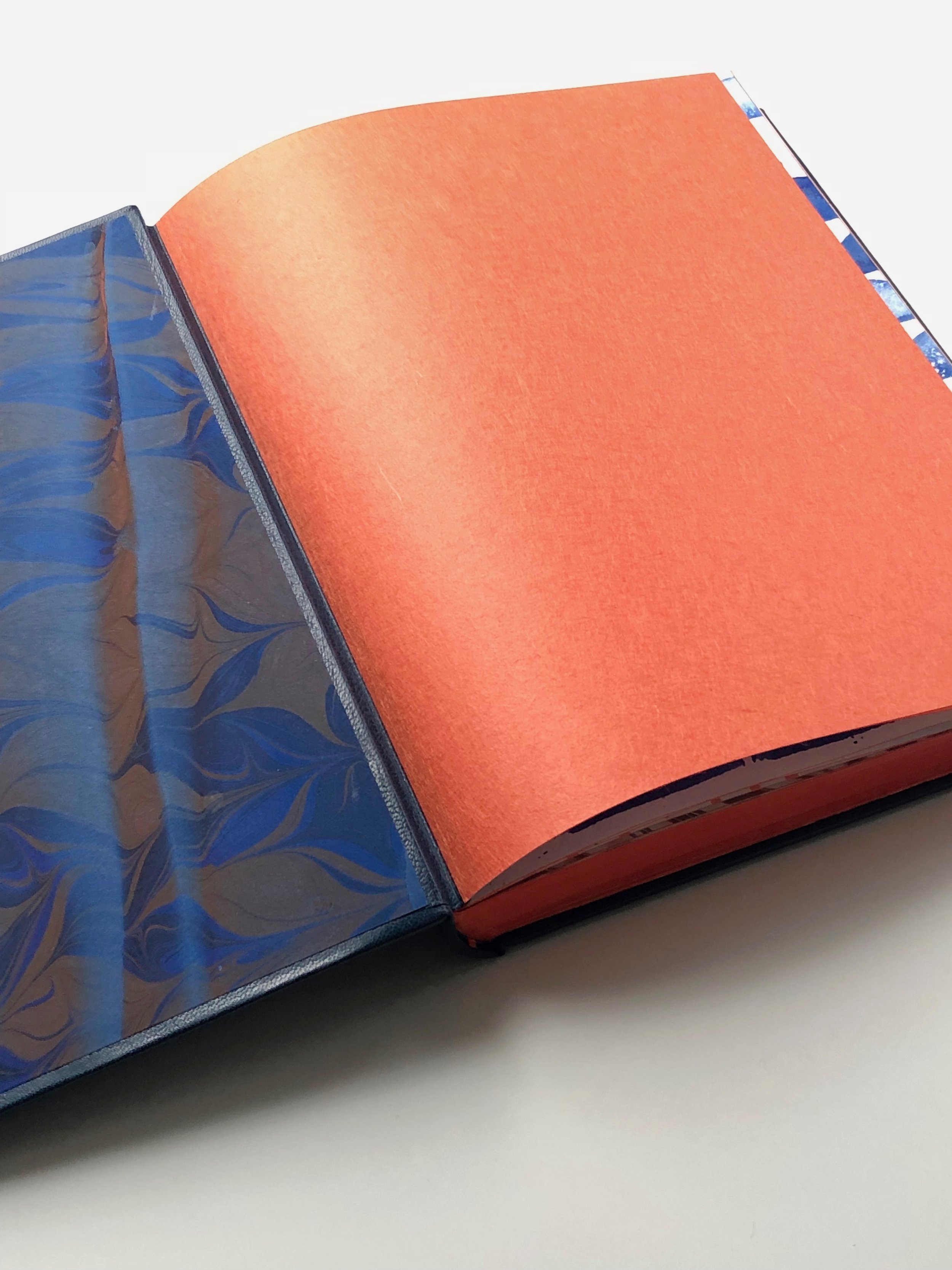 Hand-marbled pastdowns and Japanese paper flyleaf