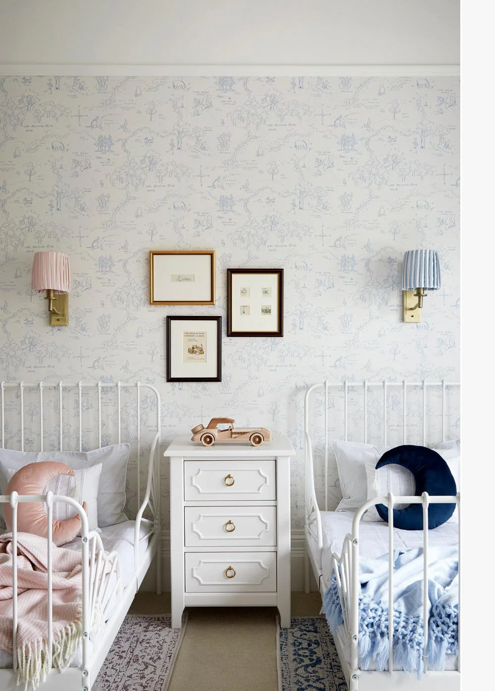 Shared kids’ bedroom with twin white metal beds, soft blue and pink decor copy.jpg