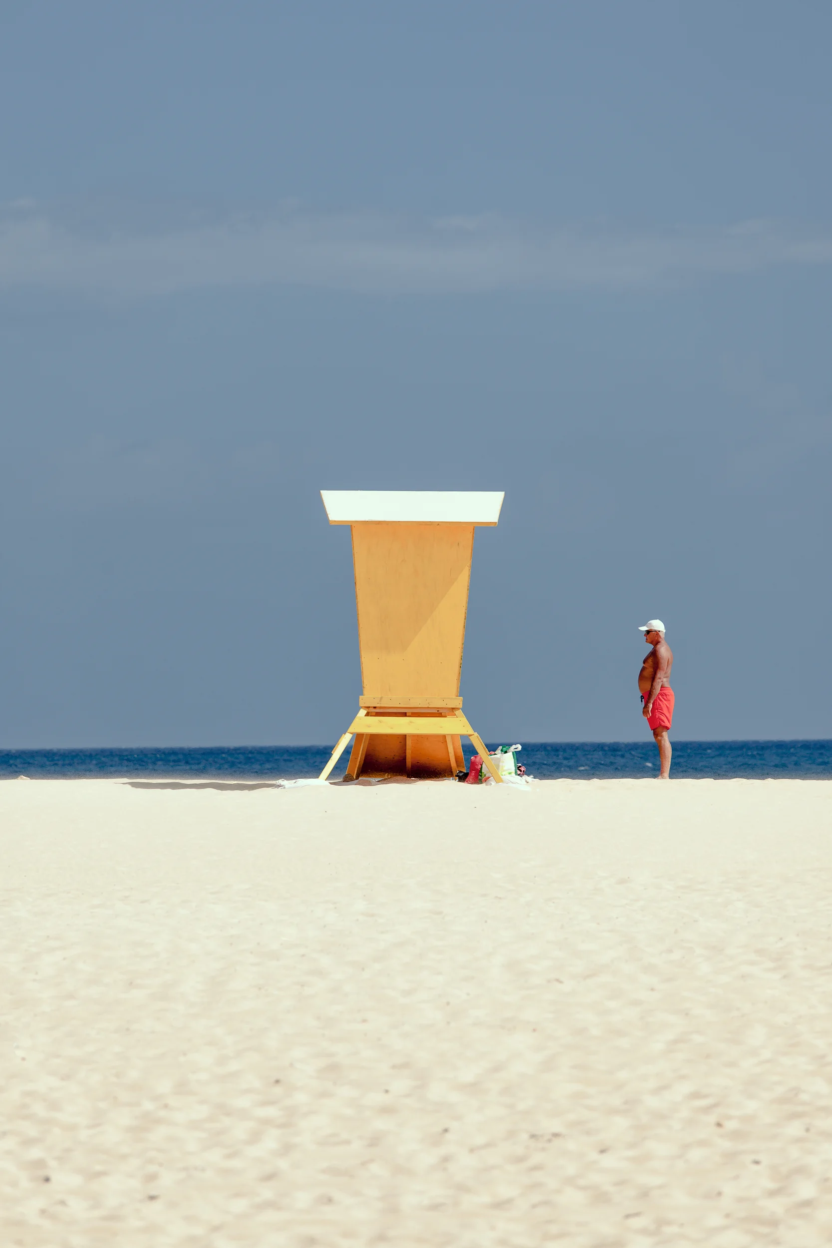 man, standing, watching, waiting, looking, funny, picture, good mood, beach, sun, summer, Spain, red shorts, swim shorts, yellow, sand Baywatch, old guy, old man, mirko, buchholz, peeck, mirko buchholz-peeck, mirko b. peeck