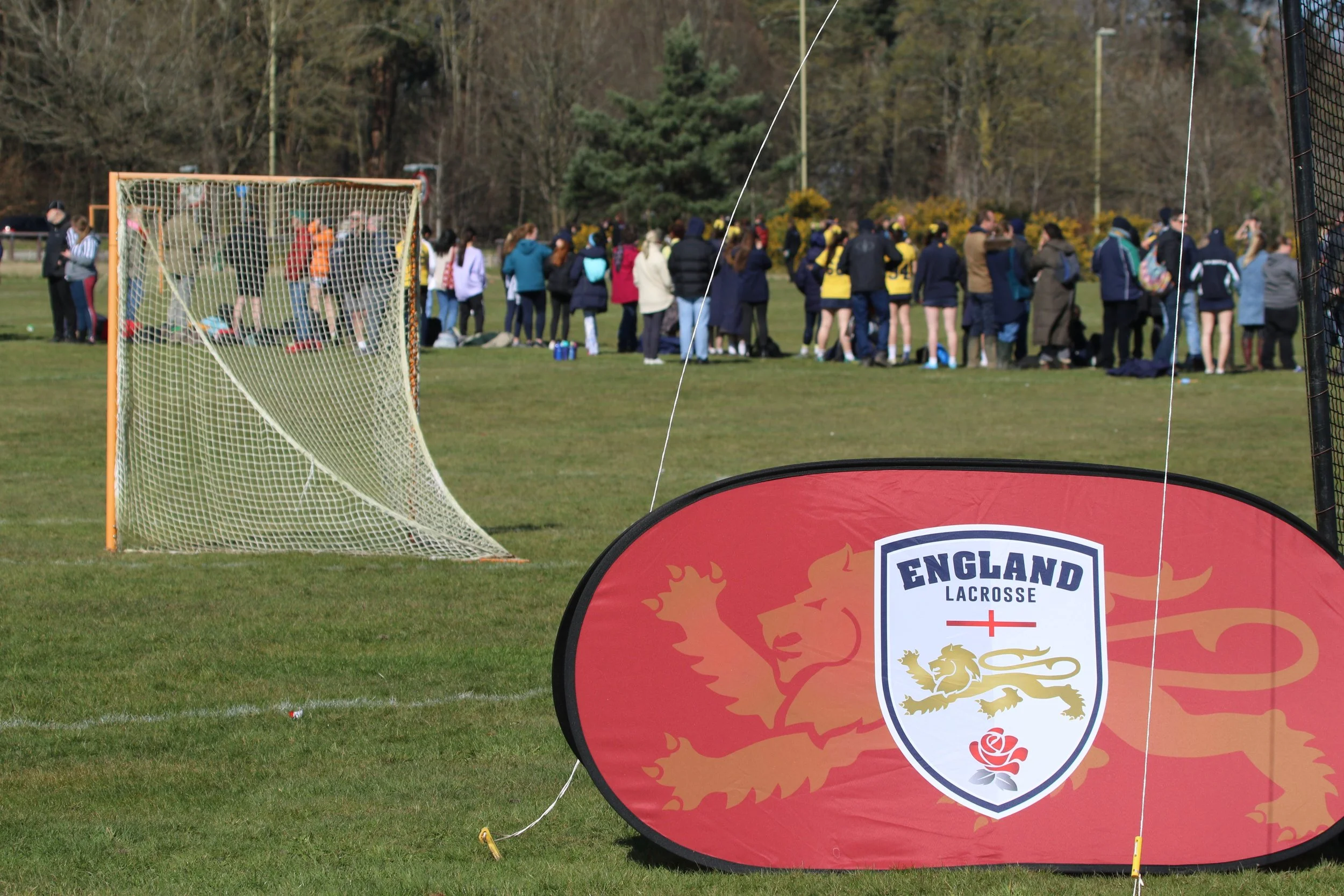 England Lacrosse pop up branding in front of a lacrosse pitch at National Schools 2022