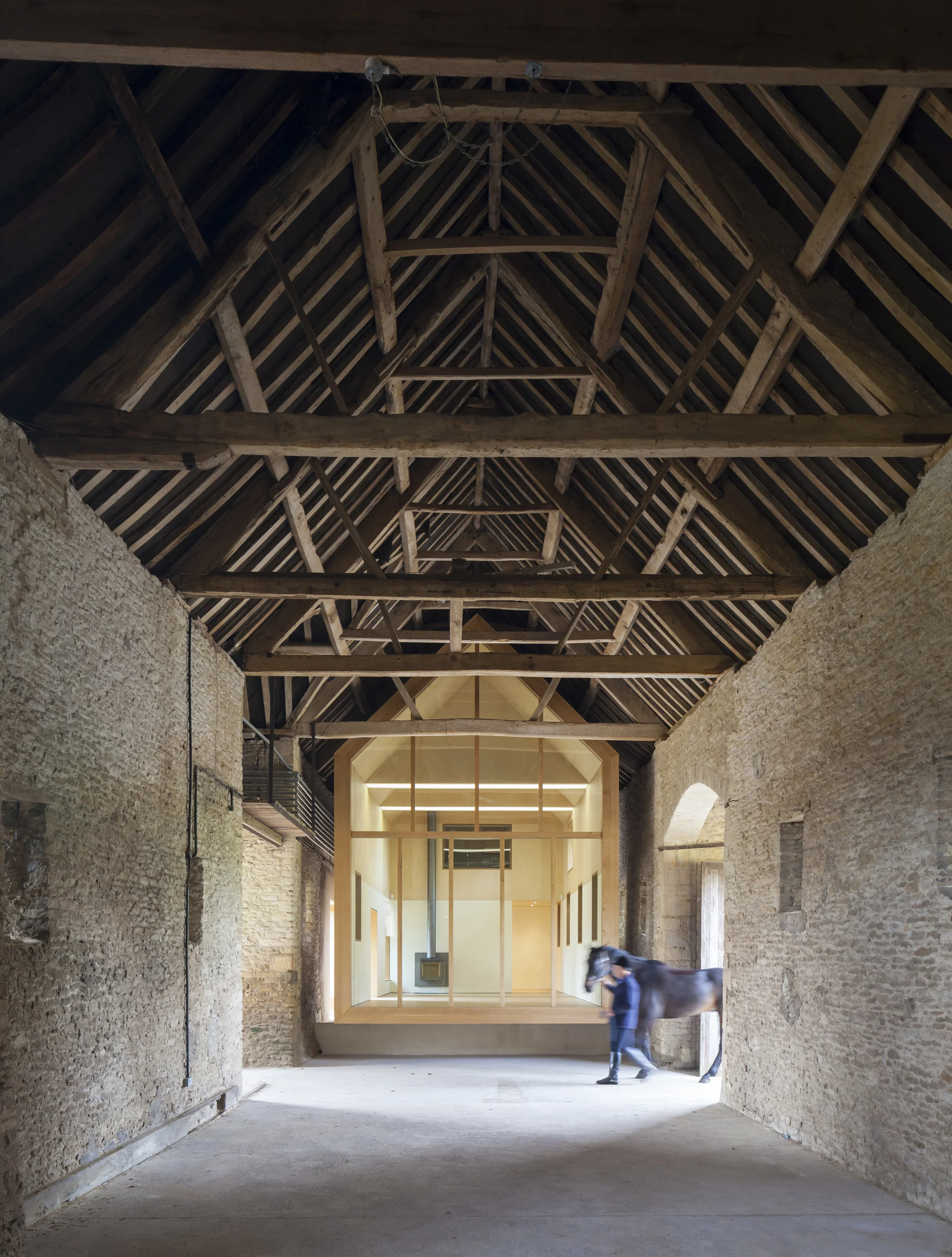 Our client wished to restore Home Farm Barn to its full glory and remove past interventions within it, which served to domesticate what is a bold historic structure. They also wanted to sensitively and creatively manage the interface between the House and the Barn.This line was blurred, and the two did not relate to each other successfully. Our client required a space within the Barn, which was warm, dry, light and airtight, and which could be used to house a personal collection of watercolour paintings.