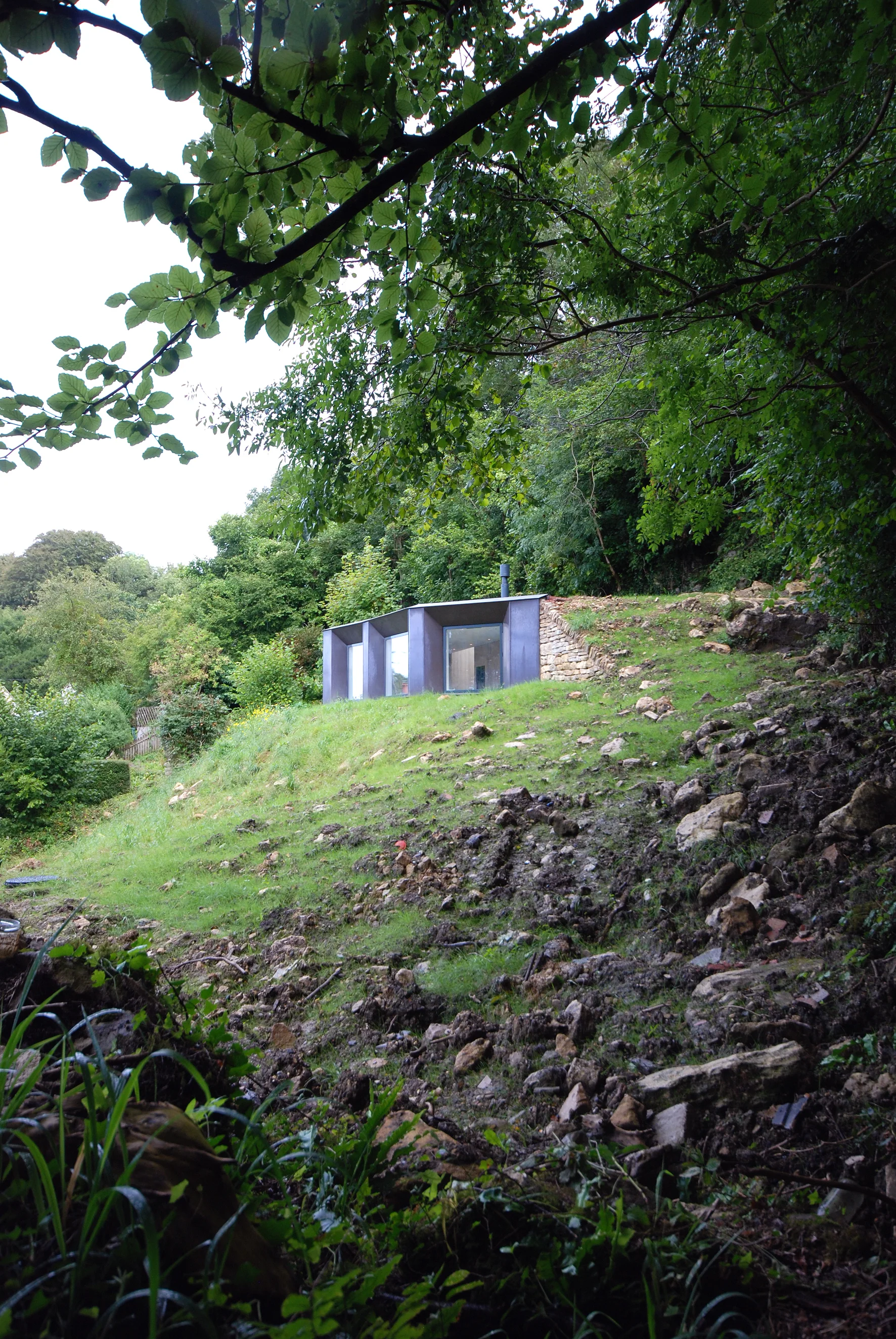 The Garden Studio serves as space to work, to sew, to play guitar, to sleep, or as a hide to observe the woodland wildlife.