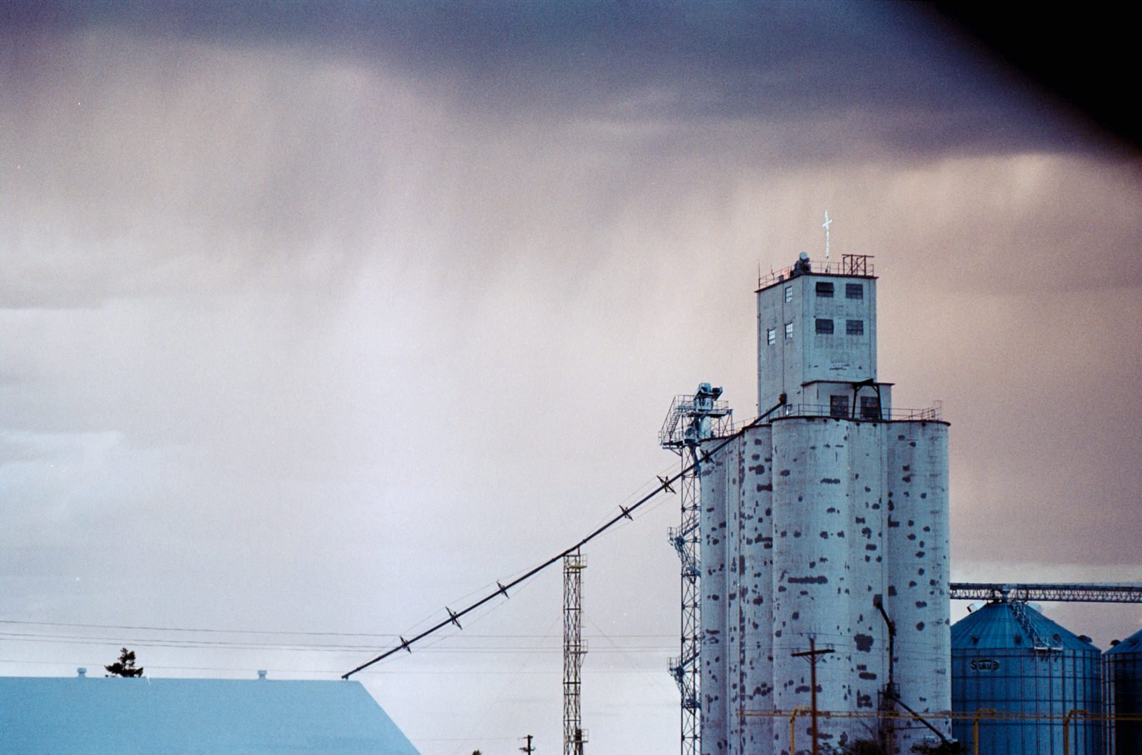 Seeing the storm hitting miles away against the the large silos that weather it all and help support the farmers.