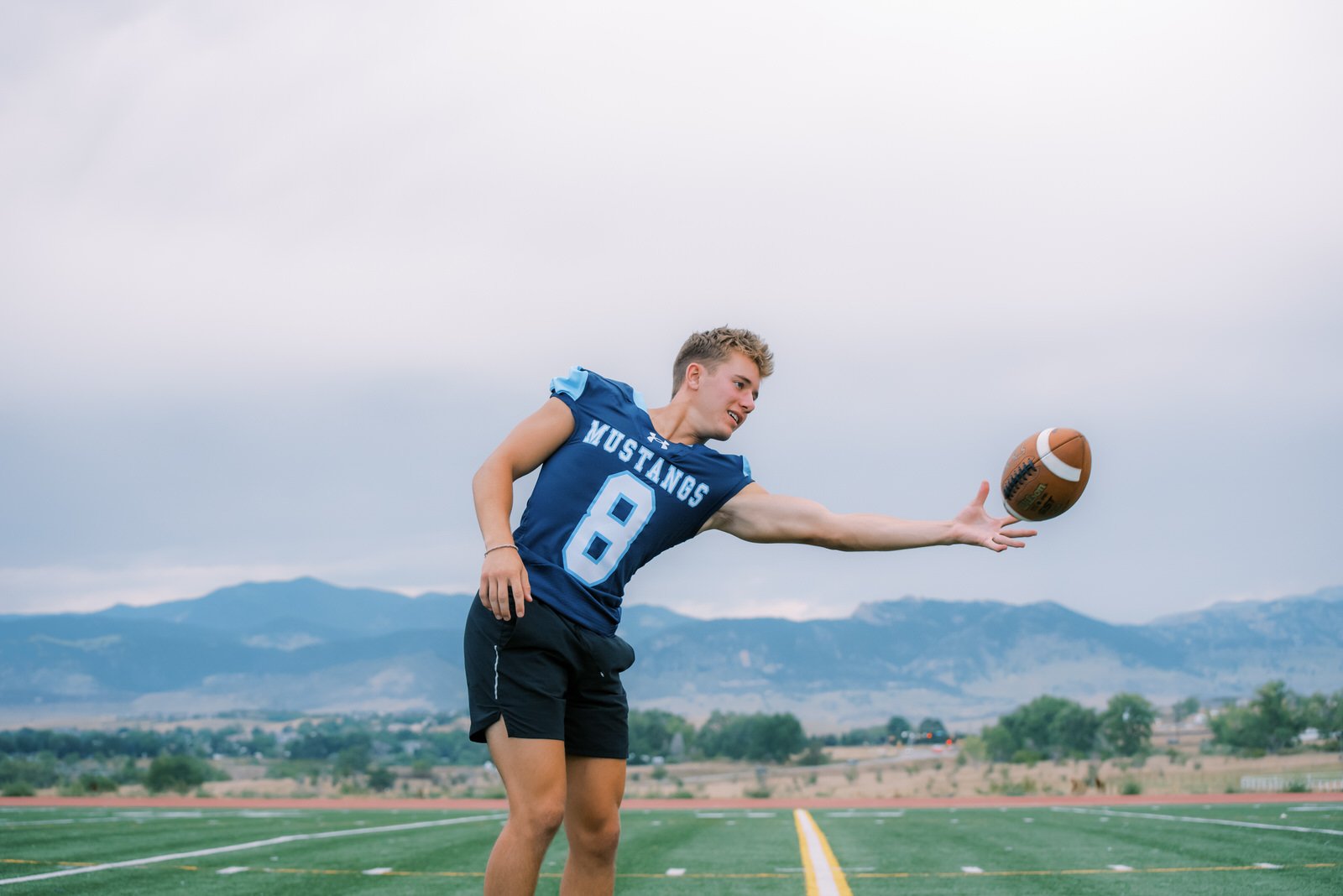 tossing the ball with his mom so I could get some non game time action shots!