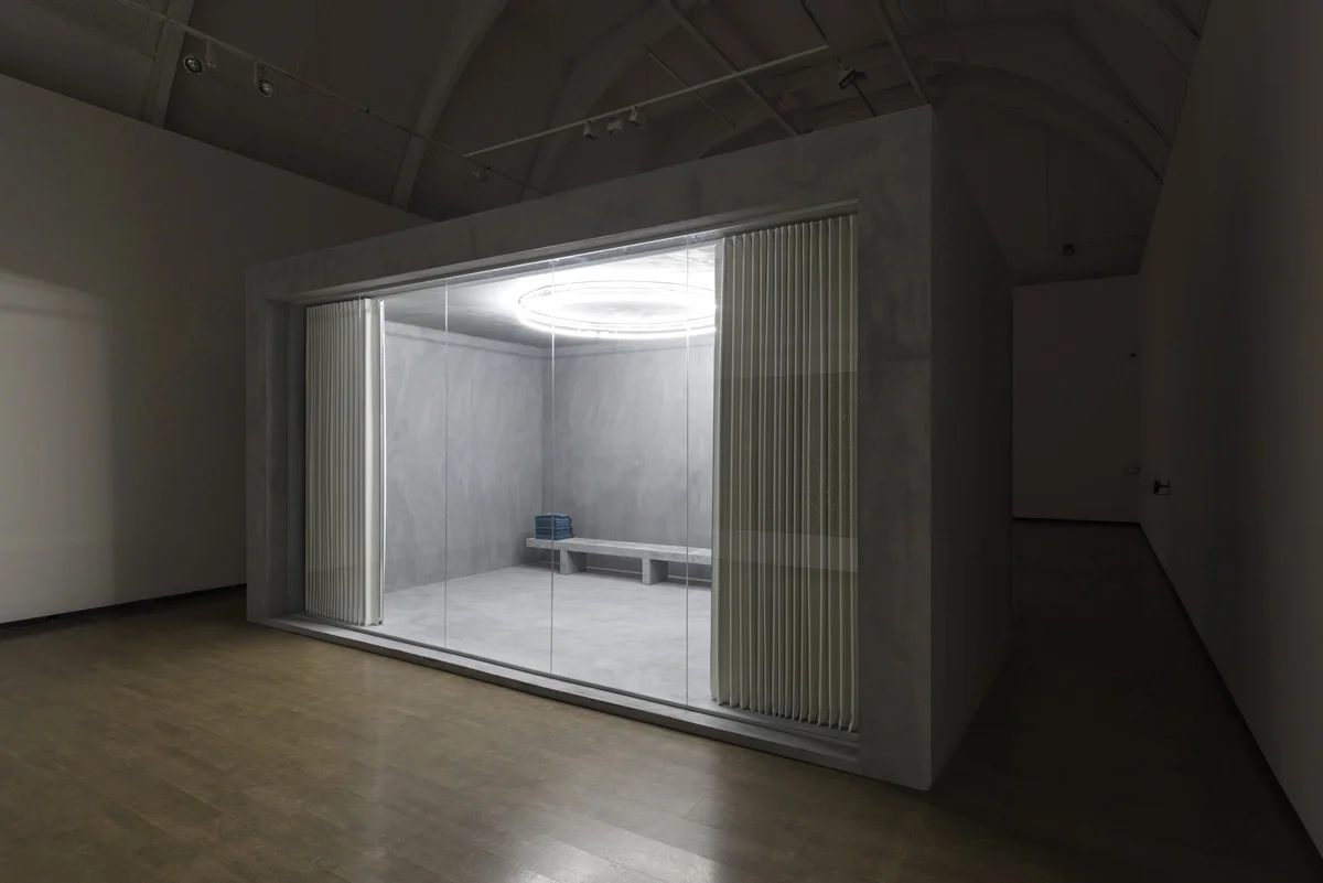 MULTIFAITH , 2015 Béton Ciré render, fabric concertina partition, wood, glass, neon, plywood, prayer mats 600 x 400 x 300 cm