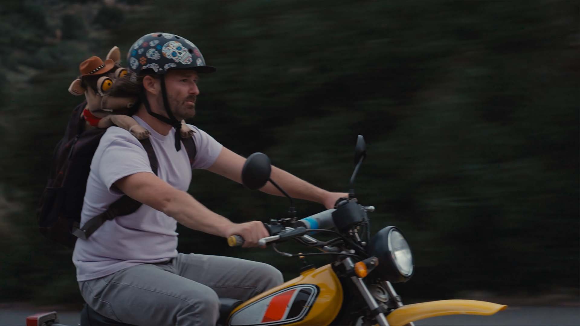 McConadilla_Layton Matthews as Henry Simms and McConadilla on a motorcycle ride.jpg