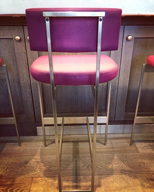 Proportion is everything.  The chair width lines up with the cabinetry panel. This masculine house has a punch of feminine power in the kitchen. Love these stools @dennismillernyc  #kitchendesign #stainlesssteel #popofpink #pinkpower #stools #homedes