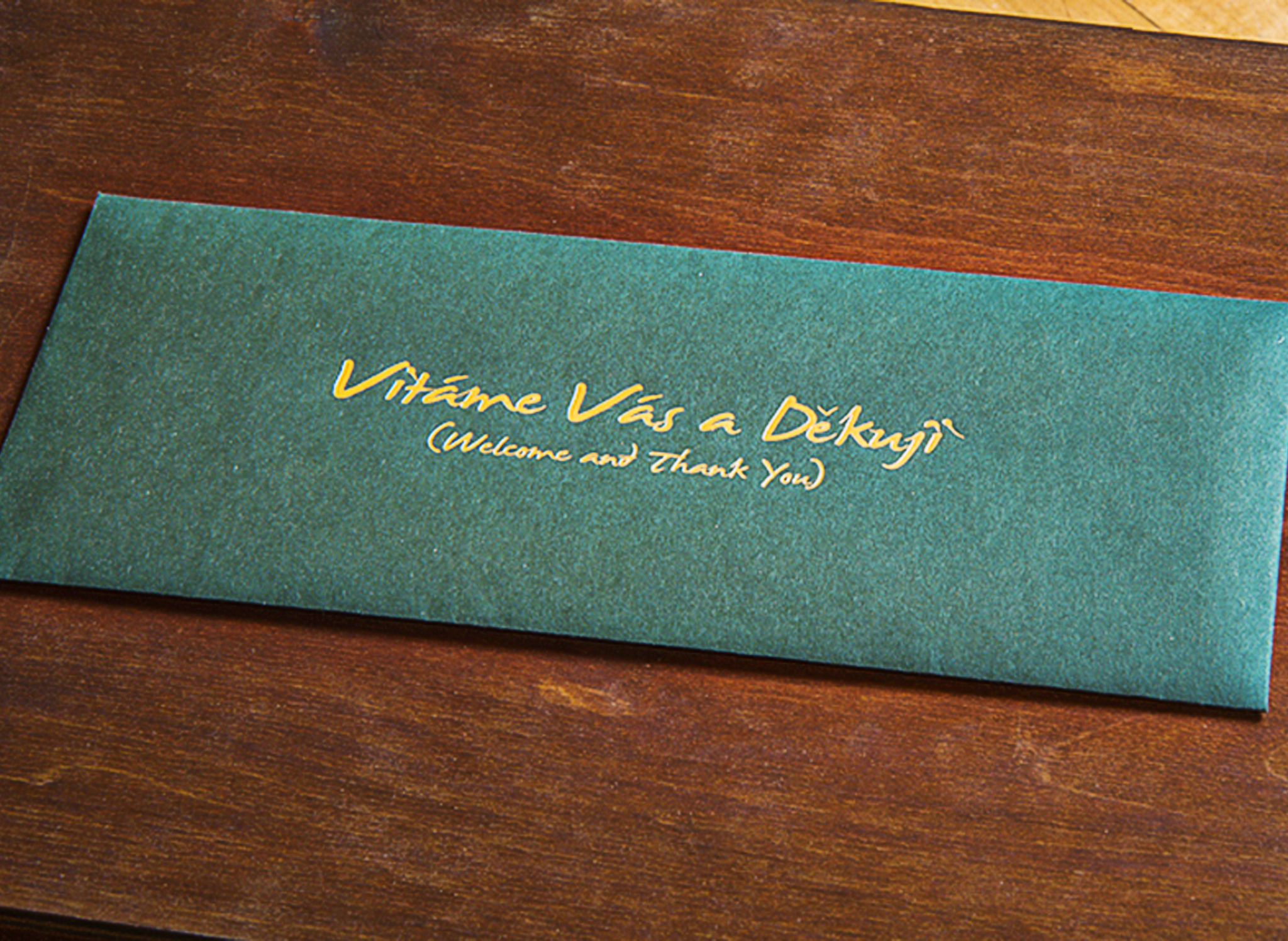A custom wooden package was created to house a welcome letter, history booklet, lapel pin, USB with educational materials, and a tasting notes card for easy reference.