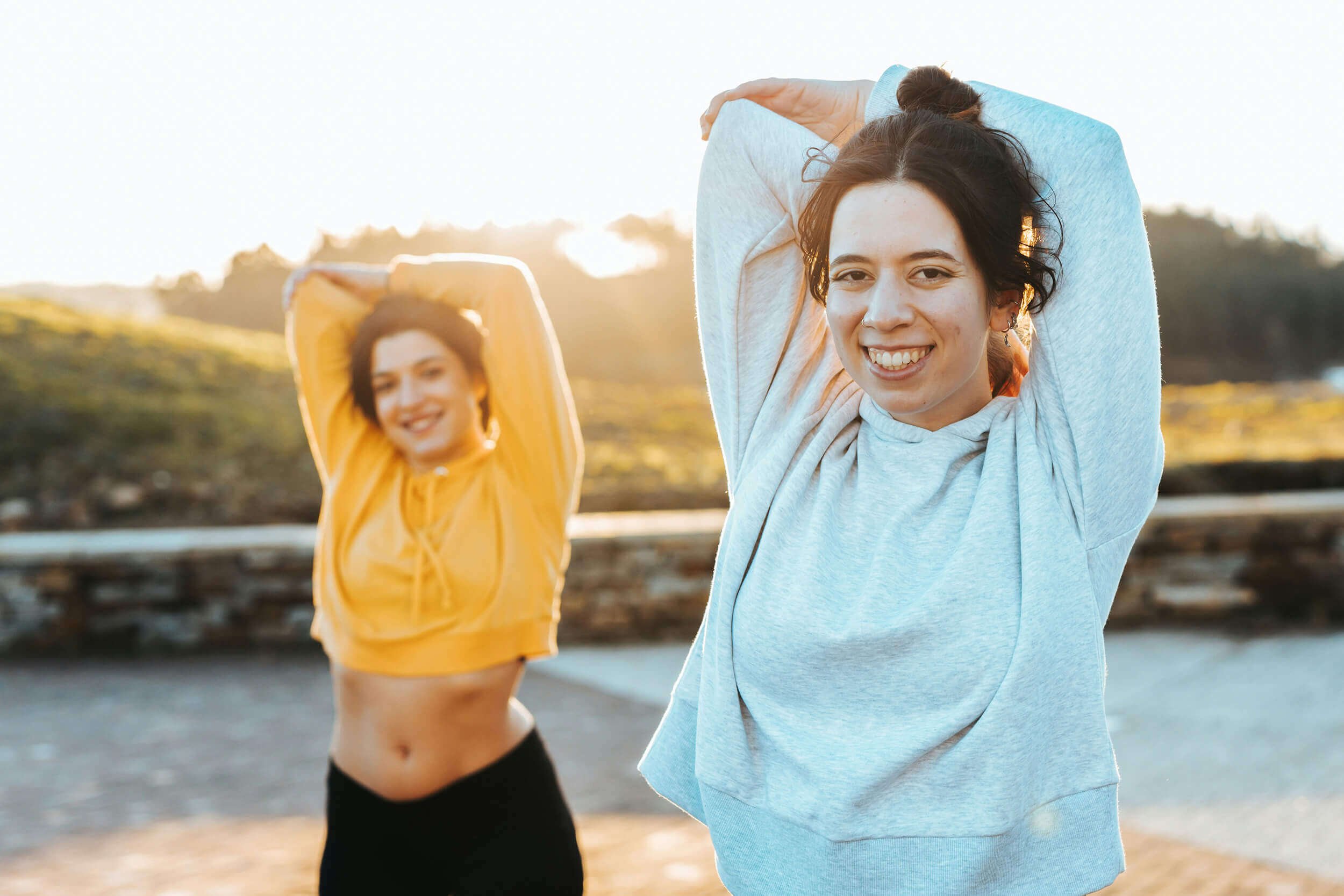 Women stretching as part of physical movement