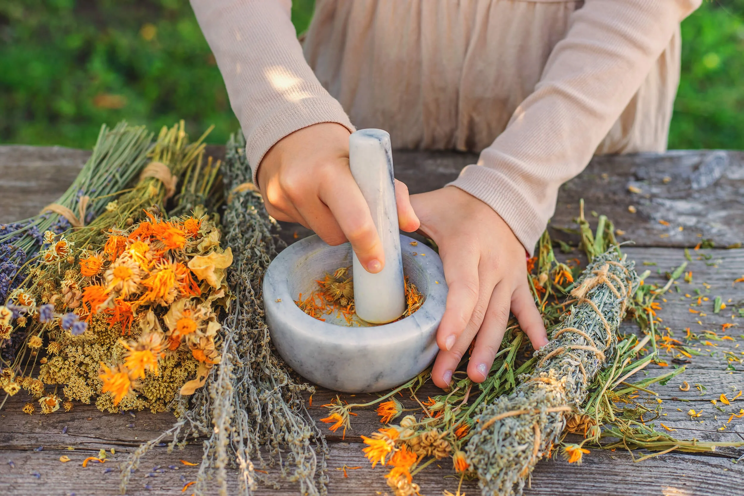 Dr. Lori DiBacco preparing herbs and natural foods for women's health.
