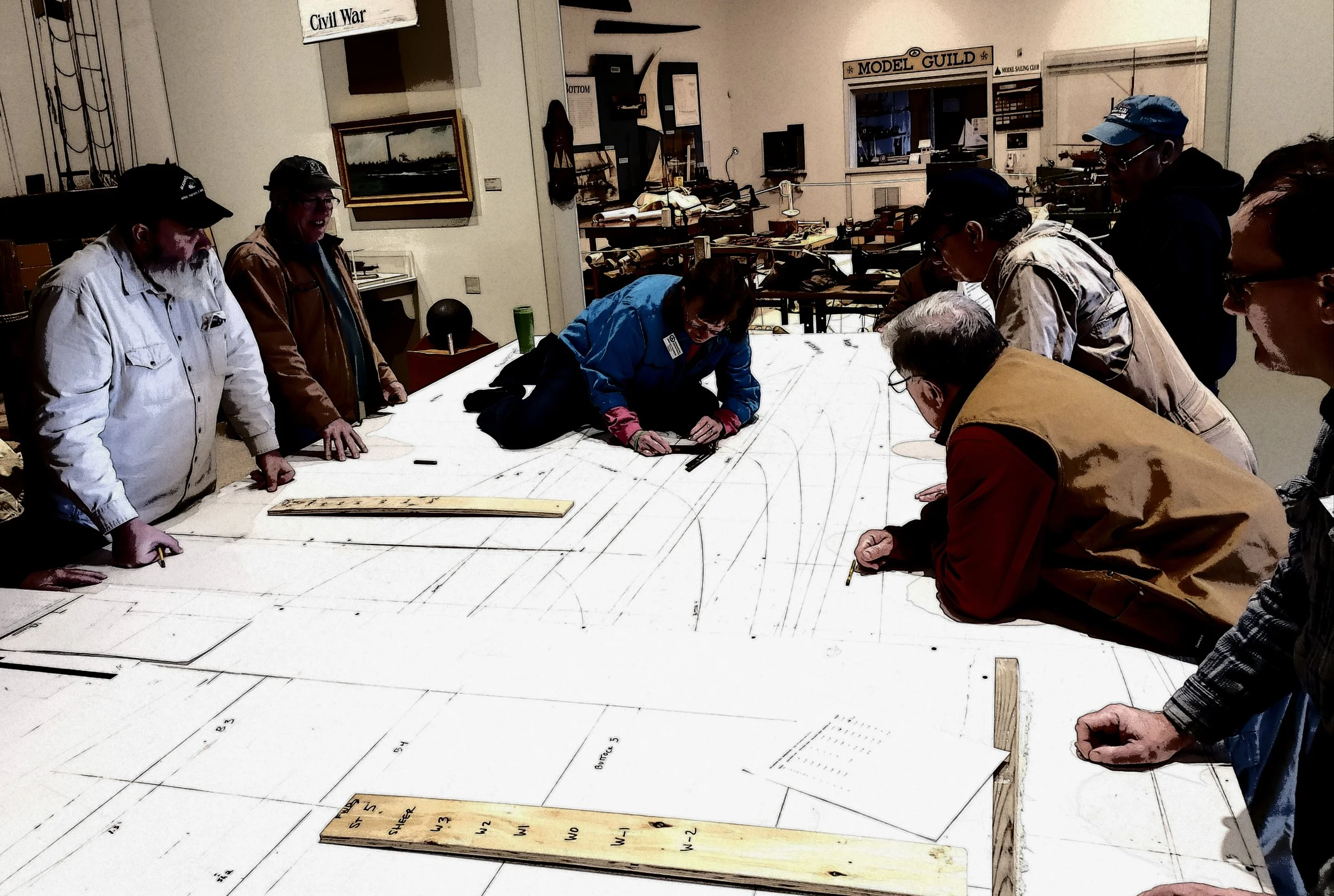 Participants are using the loft to pick up the bevels at stations 2, 5, and 7 along the sheer and our waterlines.