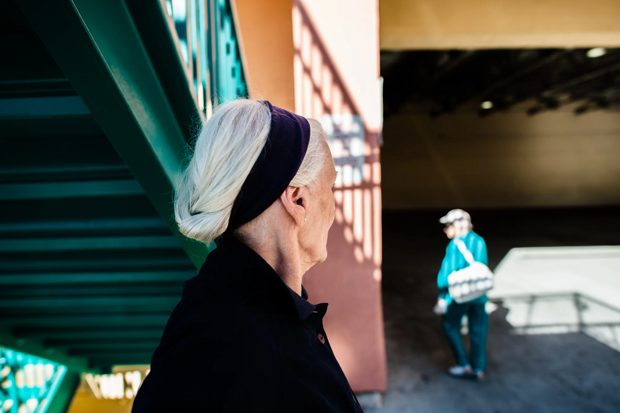 Jeanie and Adina next to a staircase at a mall near the retirement homes where they each live.