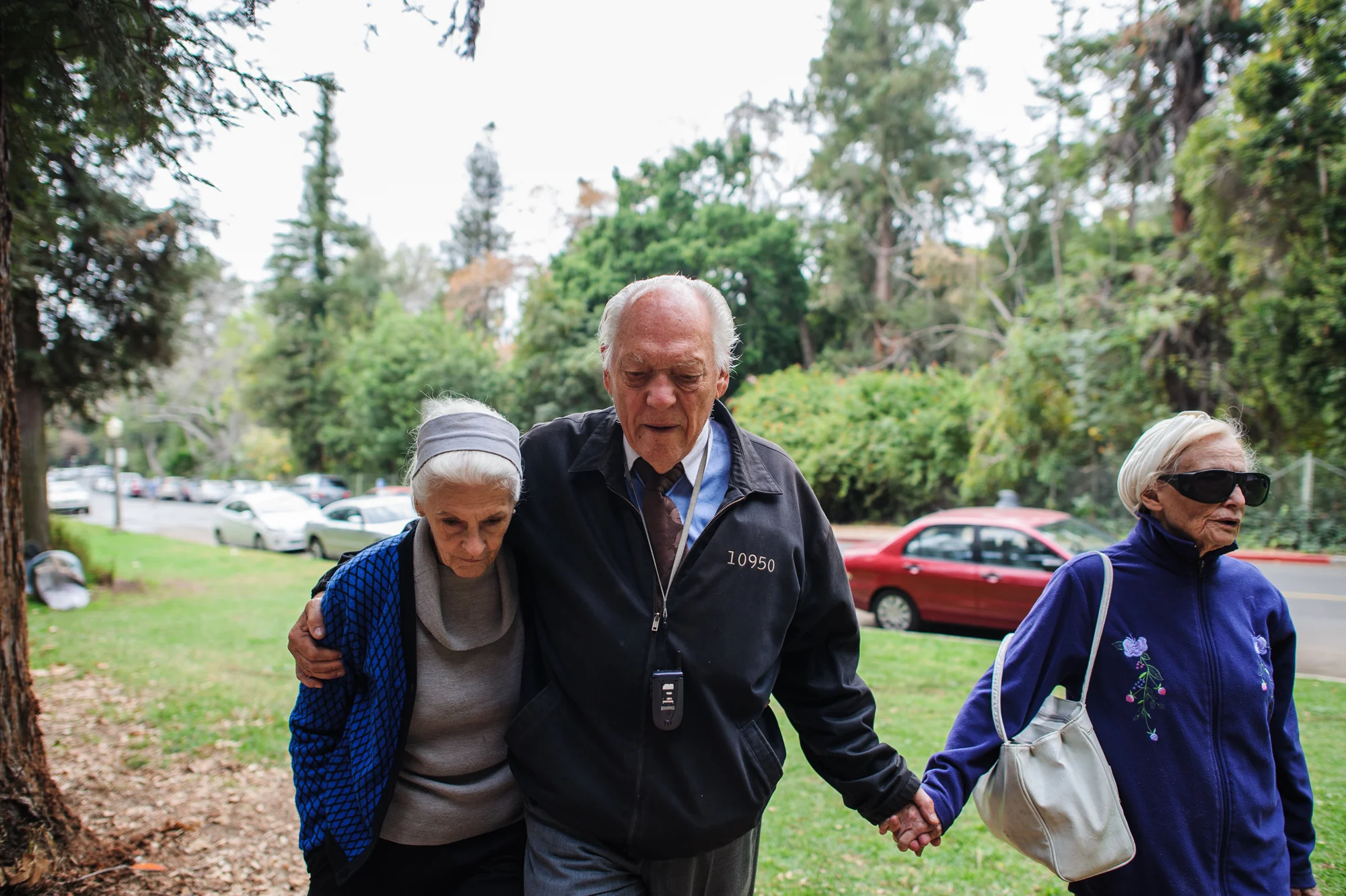 Jeanie, Will, and Adina walk in the park on a Sunday.