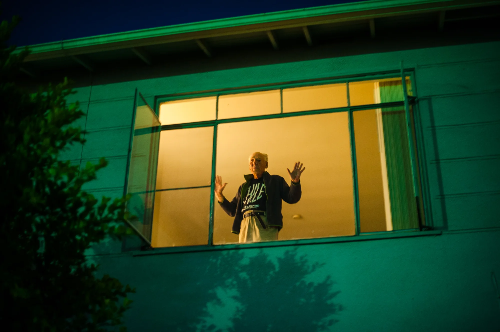 Will looks down at Jeanie from his apartment window, as she decides whether she will return to the retirement home where she lives for the night.