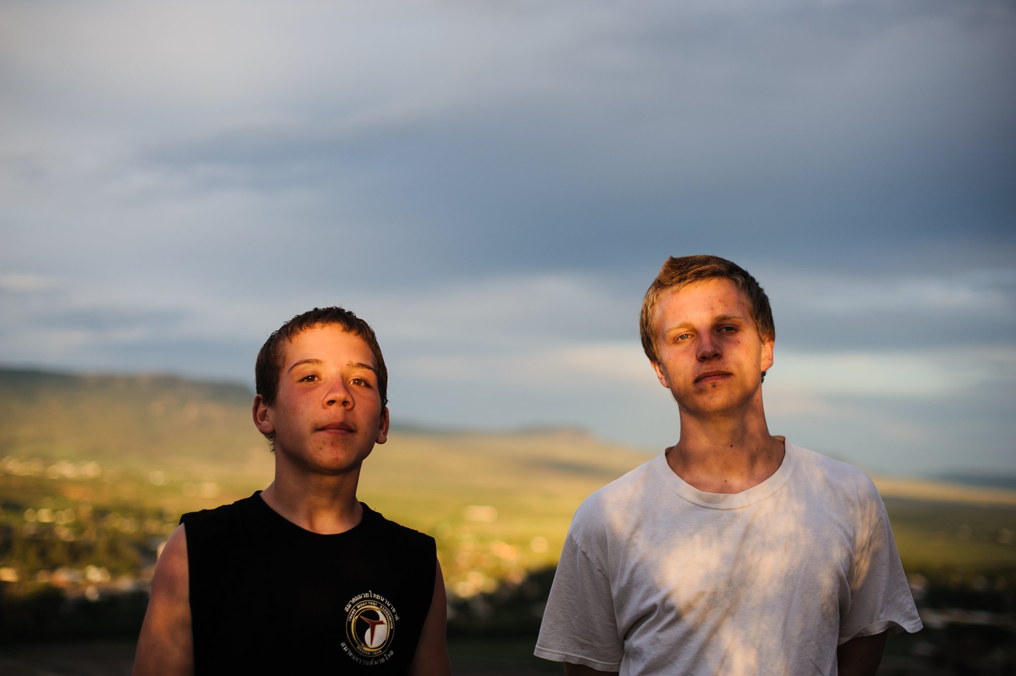  Vinny, age 14, and David, age 20, stand at the top of a mountain in Northern New Mexico before a summer storm, 2013. 