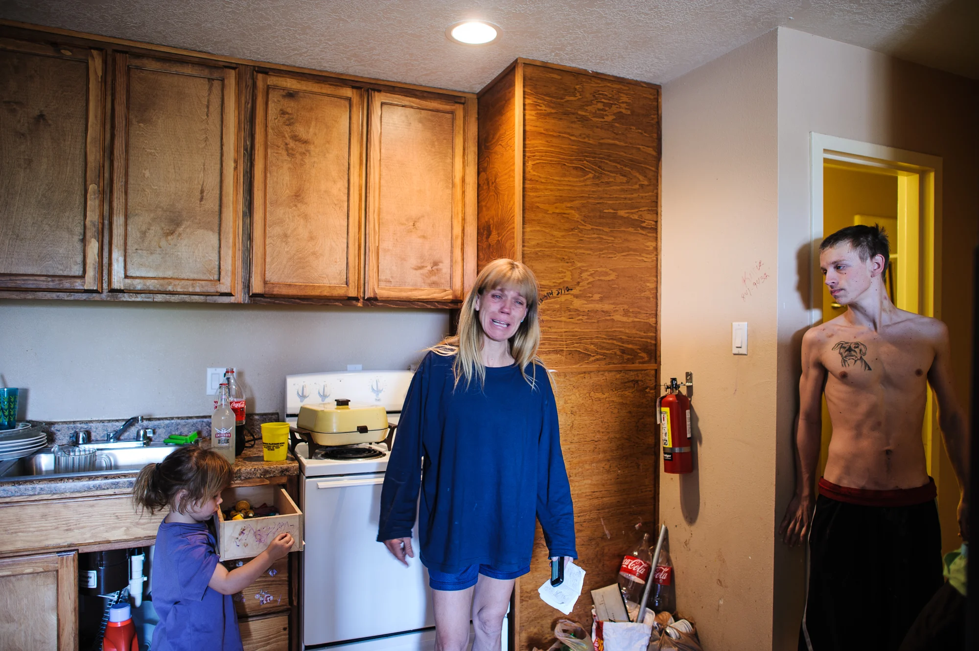 Eve, age 43, cries after receiving a phone call that the juvenile court recommends that Vinny be placed in foster care, 2012.