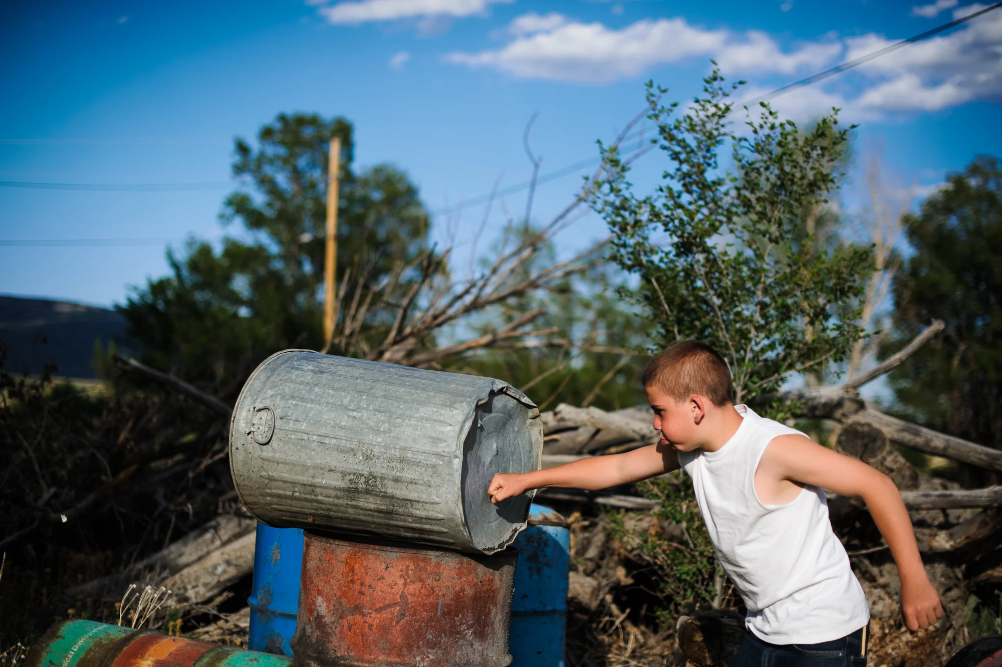 Vinny punches trashcans behind his aunt’s home, 2012.