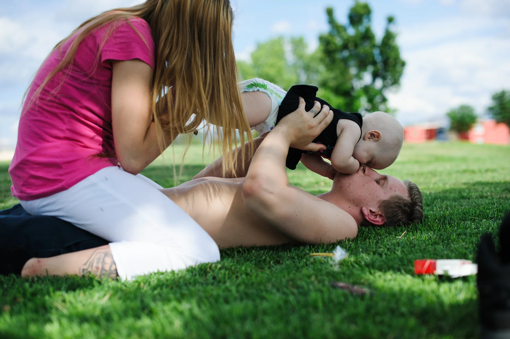 David, age 20, kisses Lilly, age 8 months, on her head, 2013.