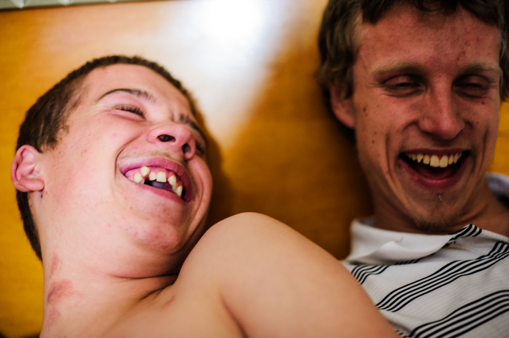  Vinny, age 15, and David, age 21, laugh, 2014. 