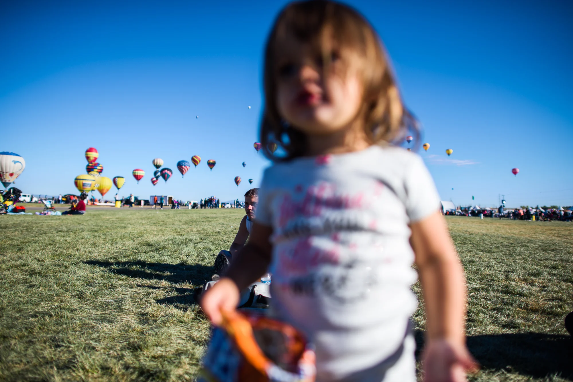 Vinny, age 18, and his daughter Jordyn, age 1, gather at the balloon fiesta in Albuquerque, 2017.