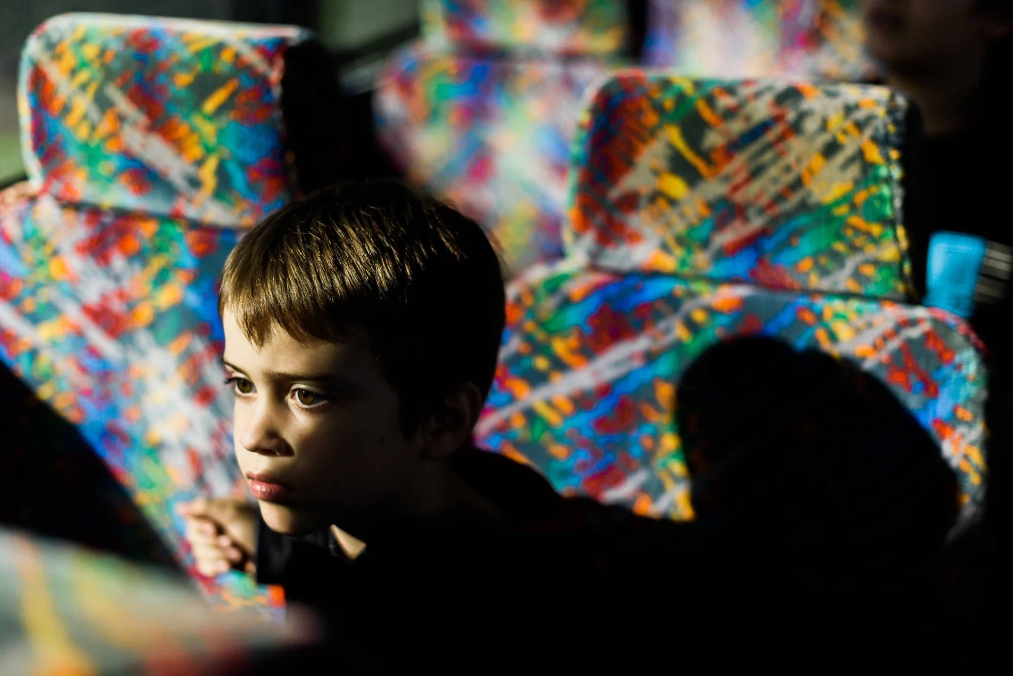 Caleb, age 7, sits on the bus bound for Hernando Correctional Institution in Brooksville, Florida, where his mom is incarcerated.