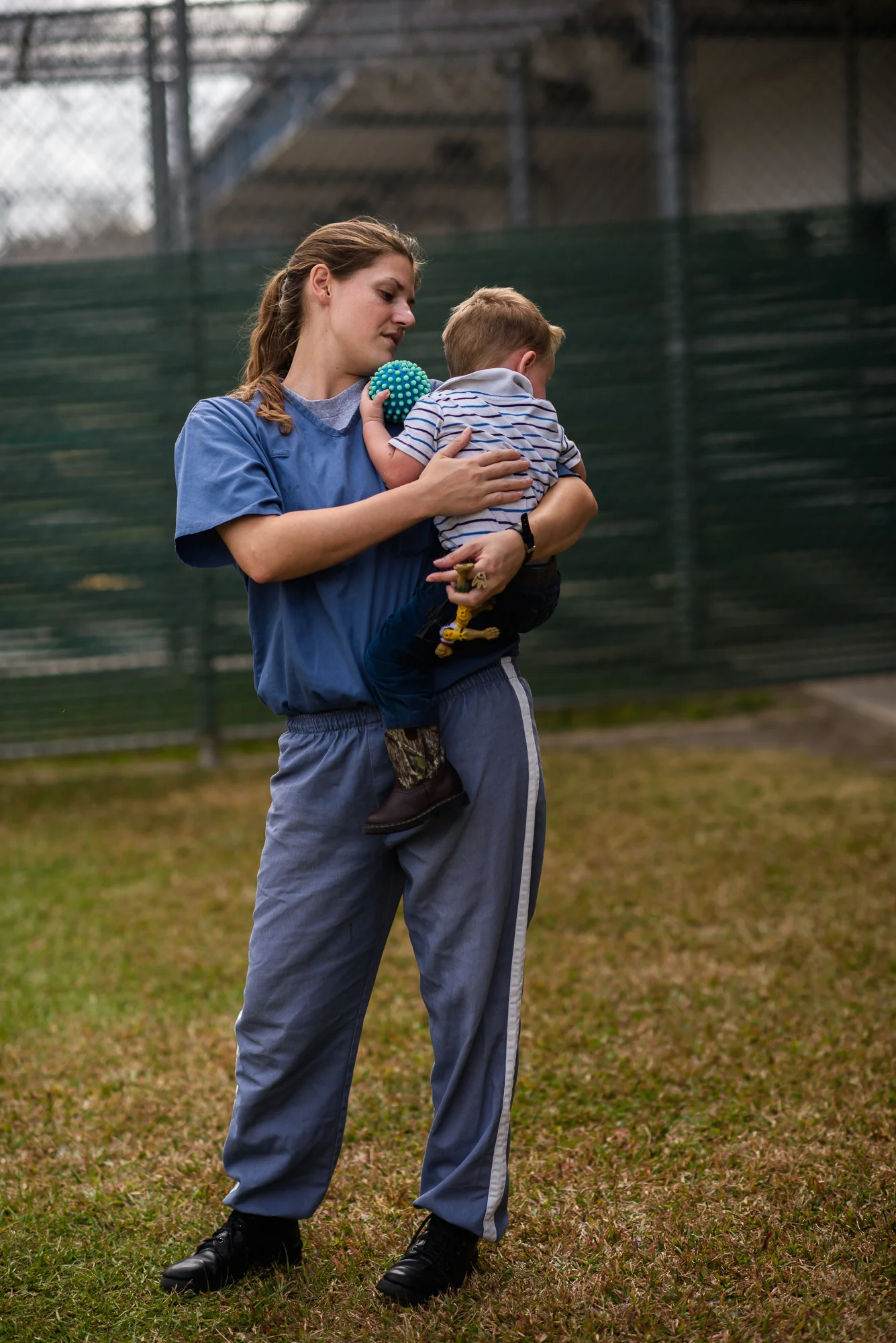 Jessie, age 23, holds her son, age 2, during a bonding visit at the Lowell Correctional Institution in Ocala, Florida. Jessie is incarcerated for 4 years for bringing controlled substances to her boyfriend during a prison visit. “Sometimes you just want love. And you’re willing to do whatever you can to get it,” she shares.