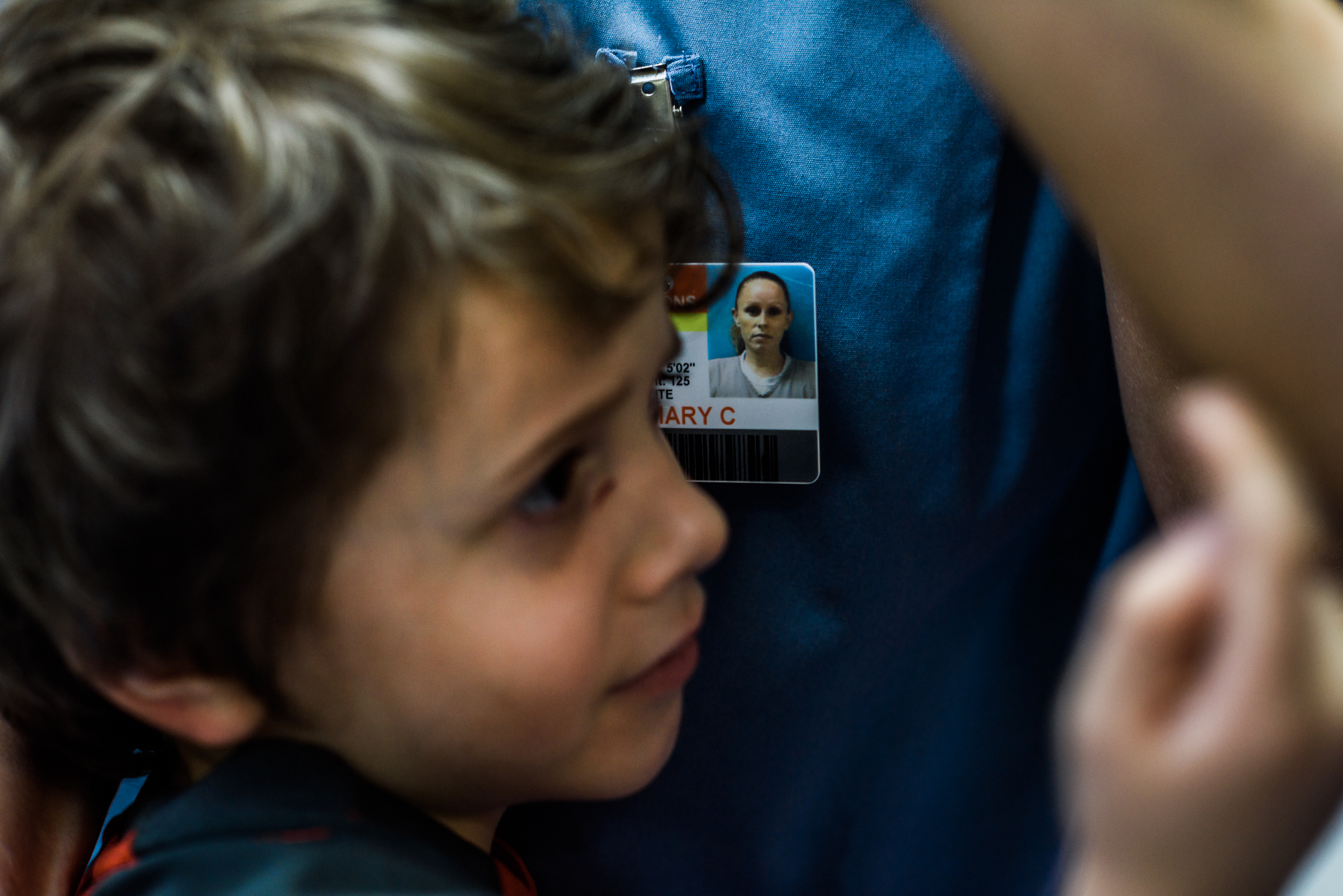  Angel, age 6, leans on his mom during a parent-child visit at the Hernando Correctional Institution, where Mary is incarcerated. 