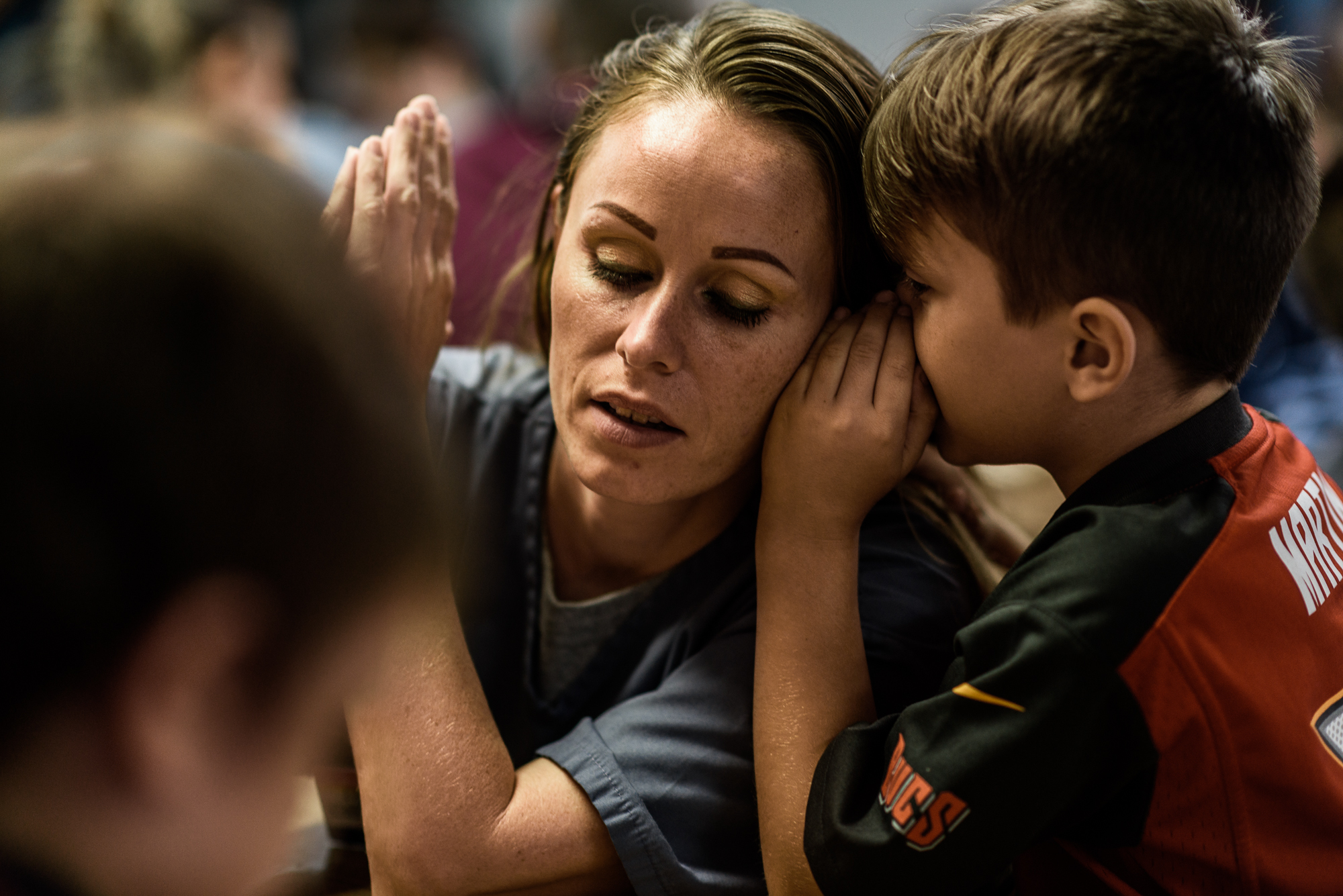  Caleb, age 7, whispers in his mom, Mary’s, ear during a visit at the Hernando Correctional Institution in Ocala, Florida. 