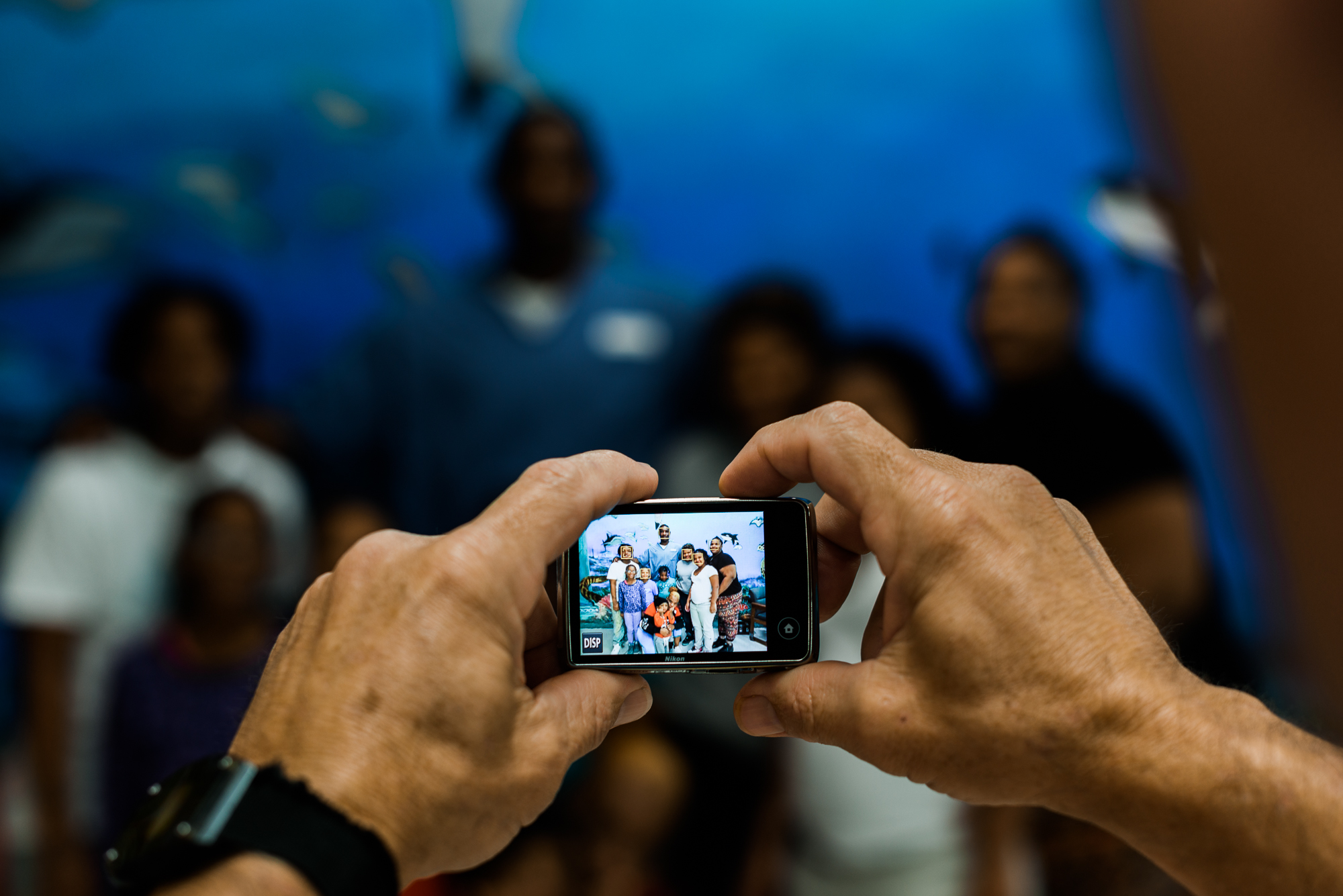  The Smith Family positions themselves for a picture taken by an incarcerated person who acts as a photographer during visits. 