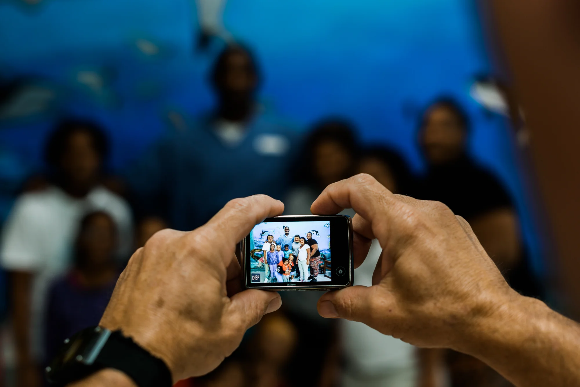 The Smith Family positions themselves for a picture taken by an incarcerated person who acts as a photographer during visits.