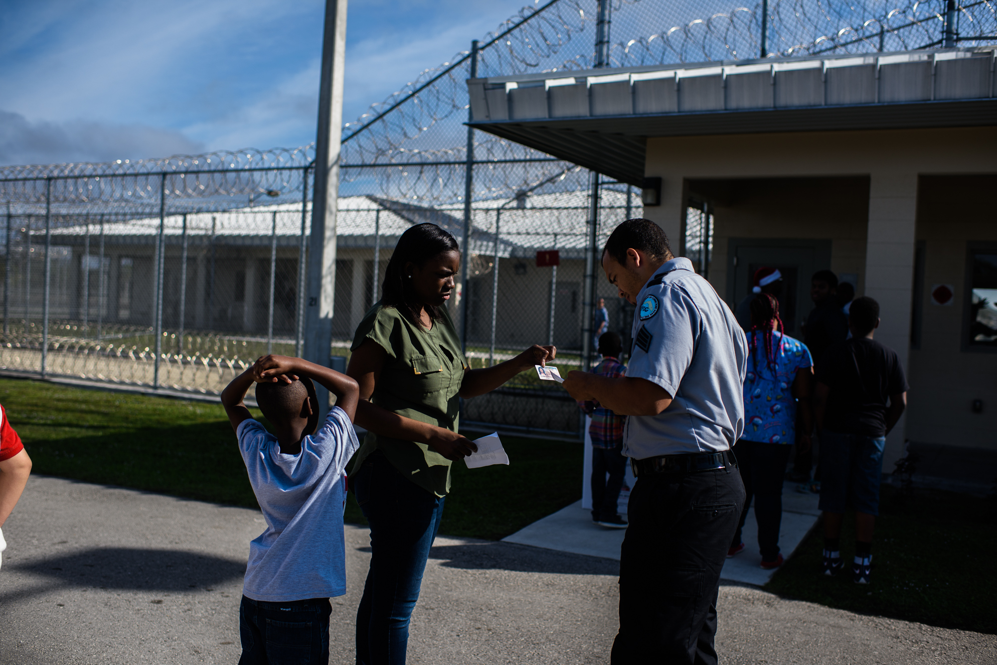  A woman and her son are checked in before a father-child visit at the Everglades Reentry Center in Miami, Florida. 