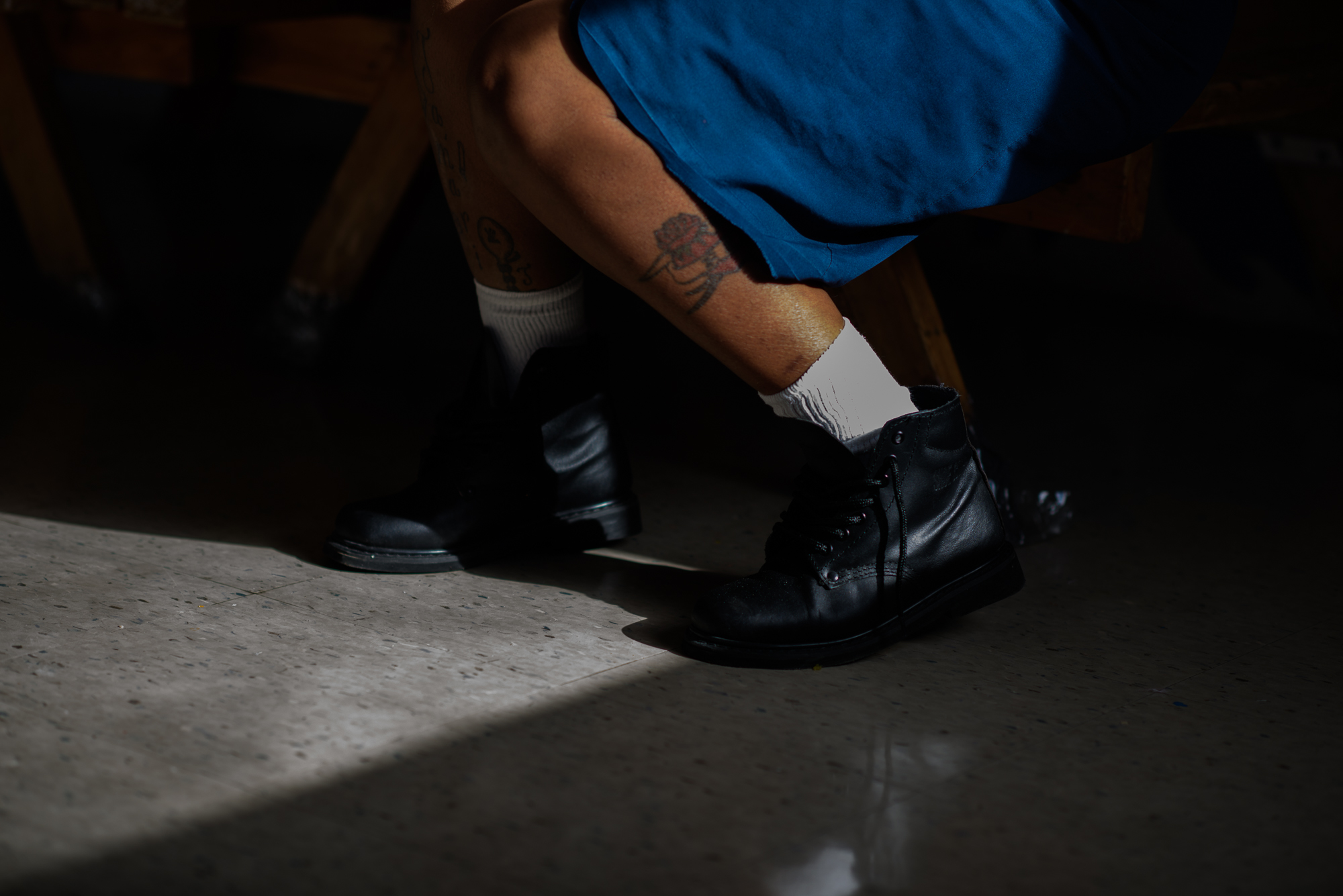  A woman’s leg as she sits during a mother-child visit at Homestead Correctional Institution in Florida City, Florida. 