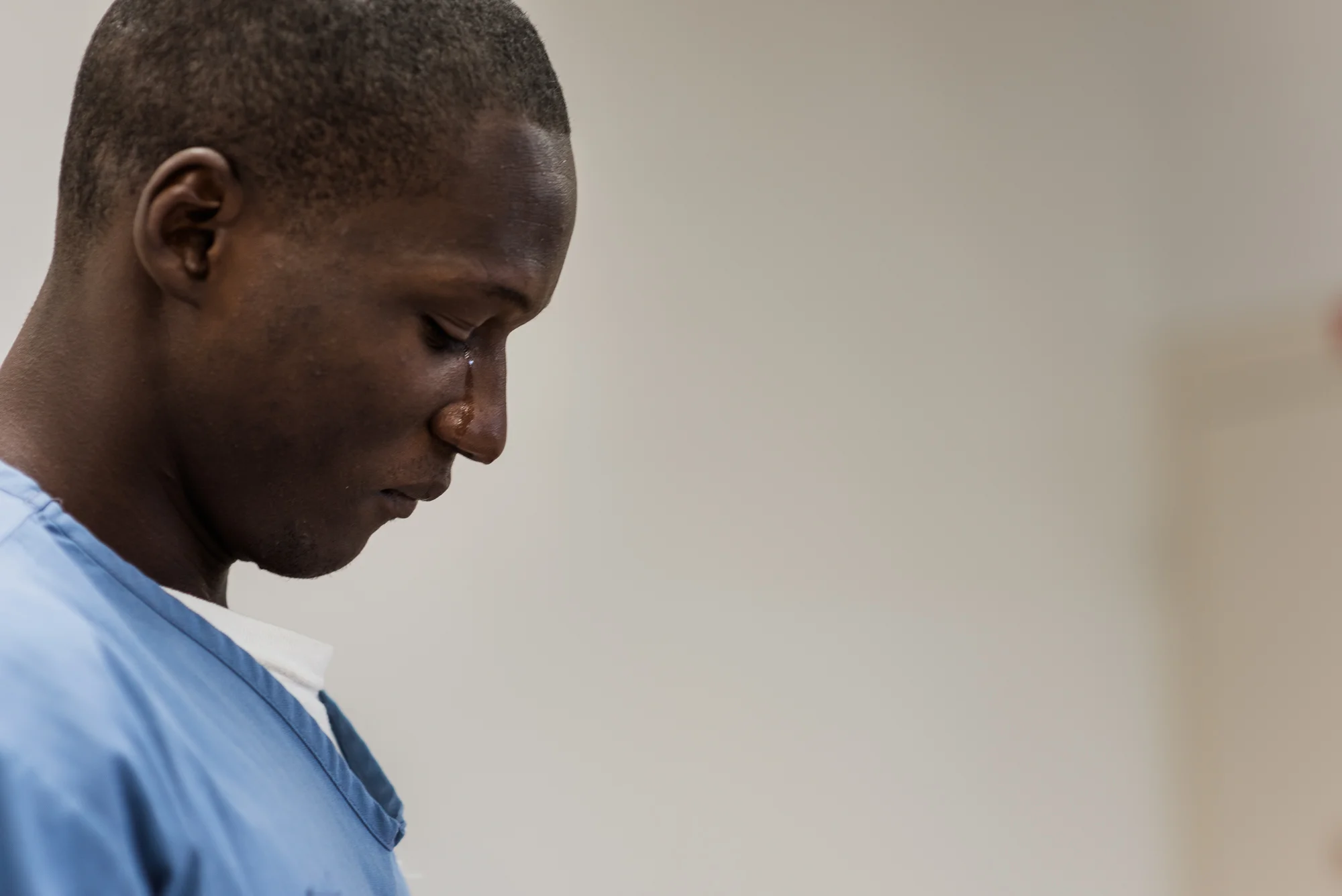 Eric cries after saying goodbye to his son and daughter at the Okeechobee Correctional Institution in Okeechobee, Florida. “They don’t know how much I miss them.”