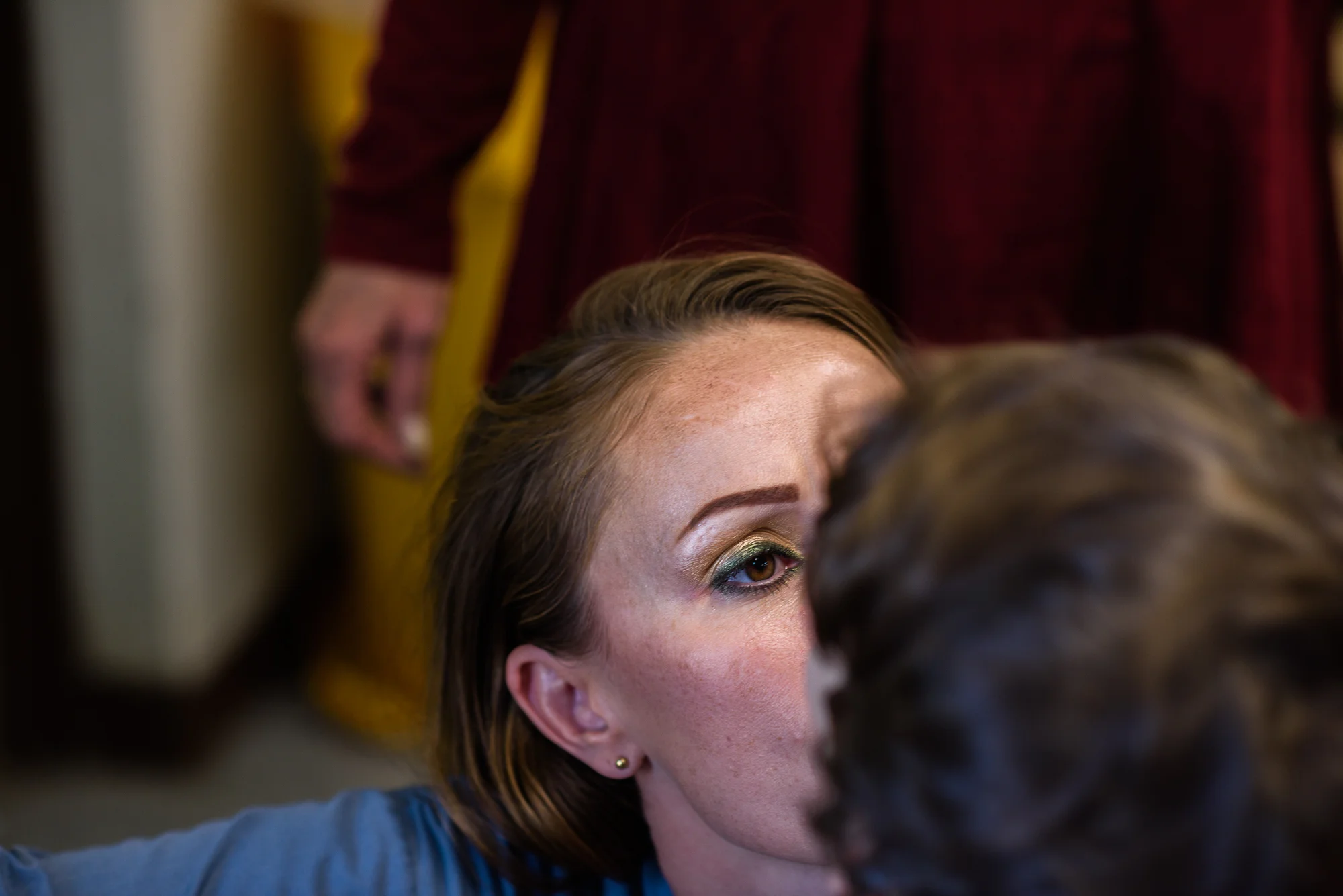 Mary looks at her son Angel, age 6, as her mother, Mary, who is the children’s guardian, stands behind.