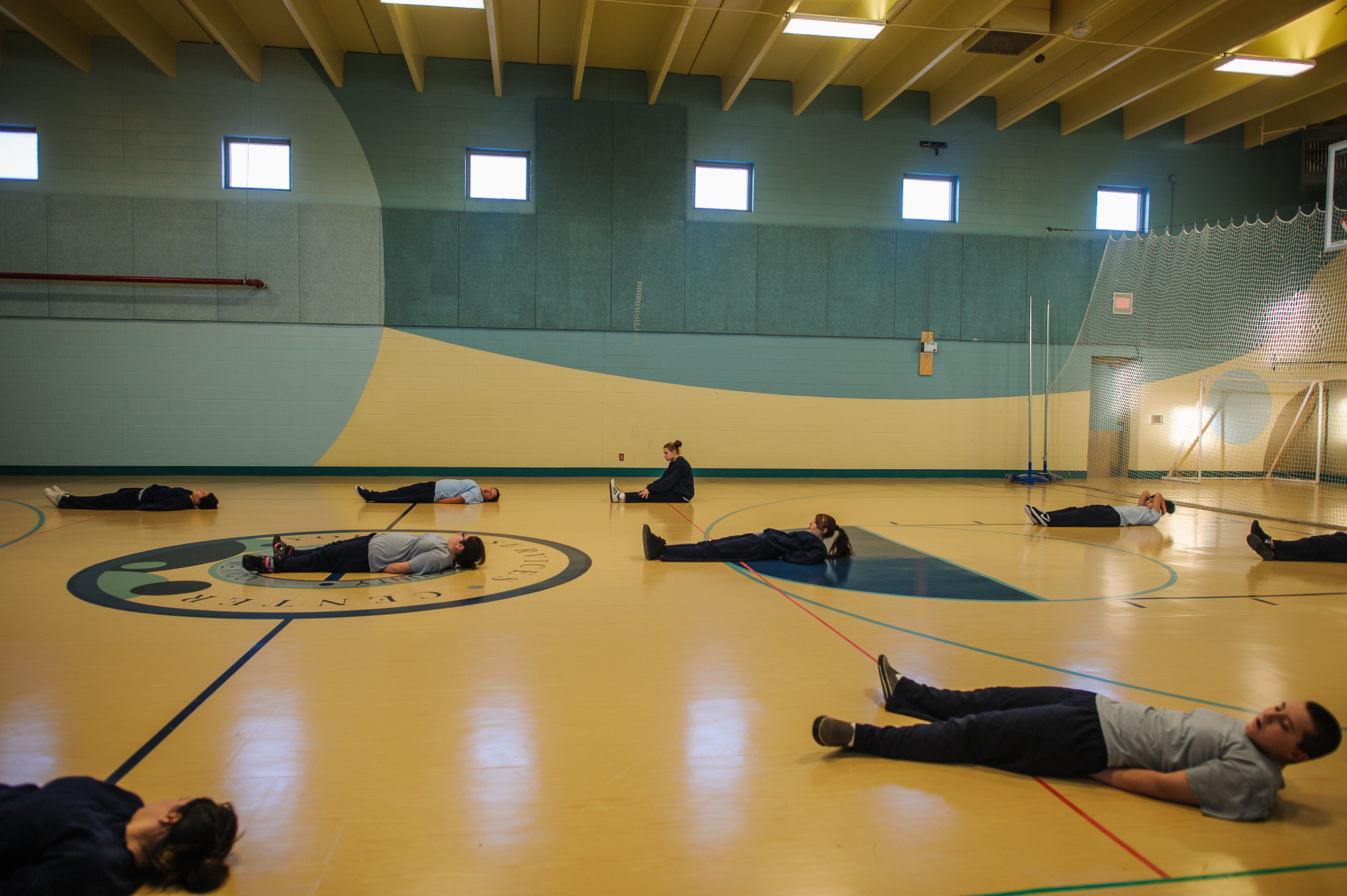  Alysia, age 16, sits up during exercise in the gym at the juvenile detention center.  